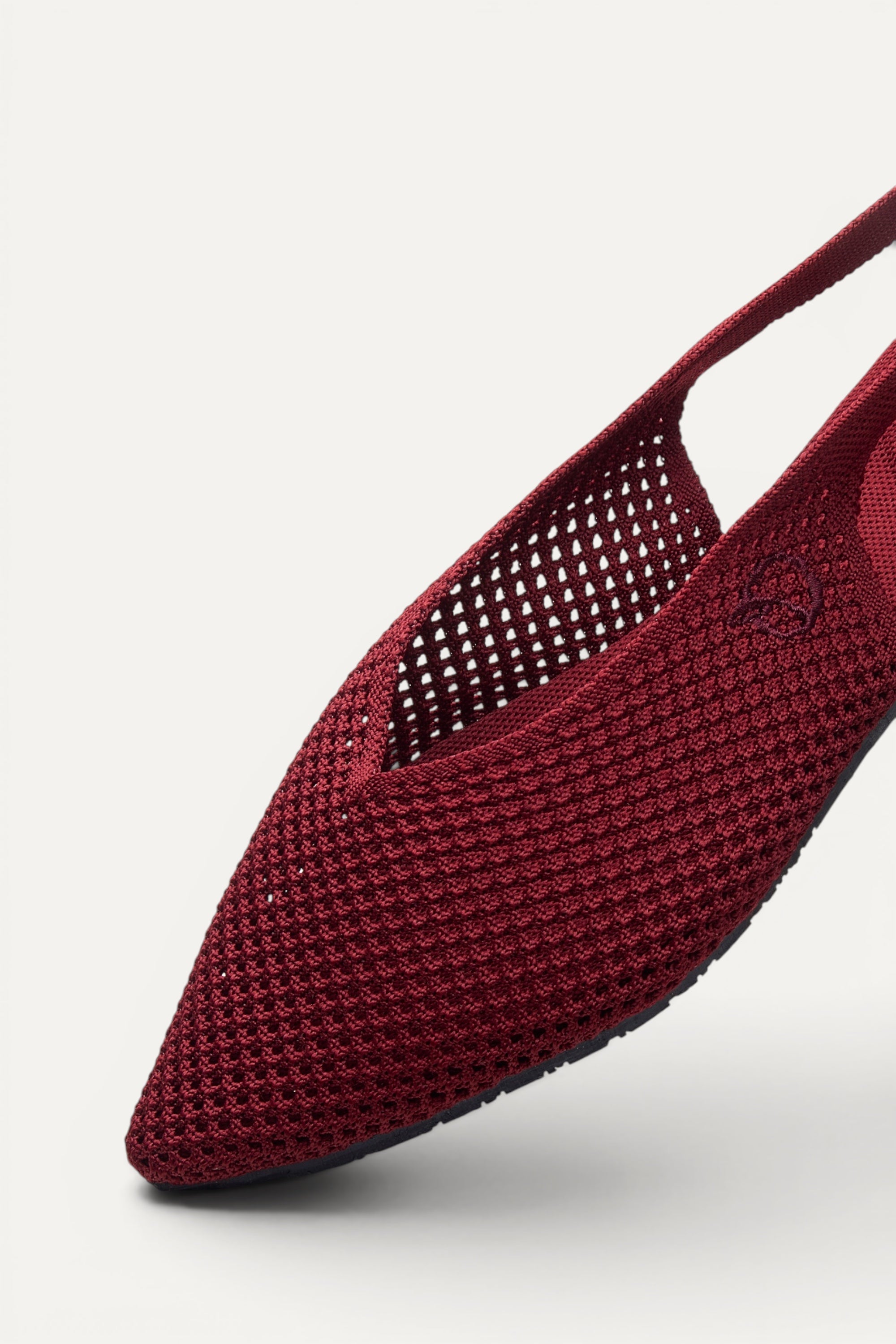 Side view of Rioz Maroon Airknit Slingbacks, sleek pointed-toe knit flats with open-mesh upper.