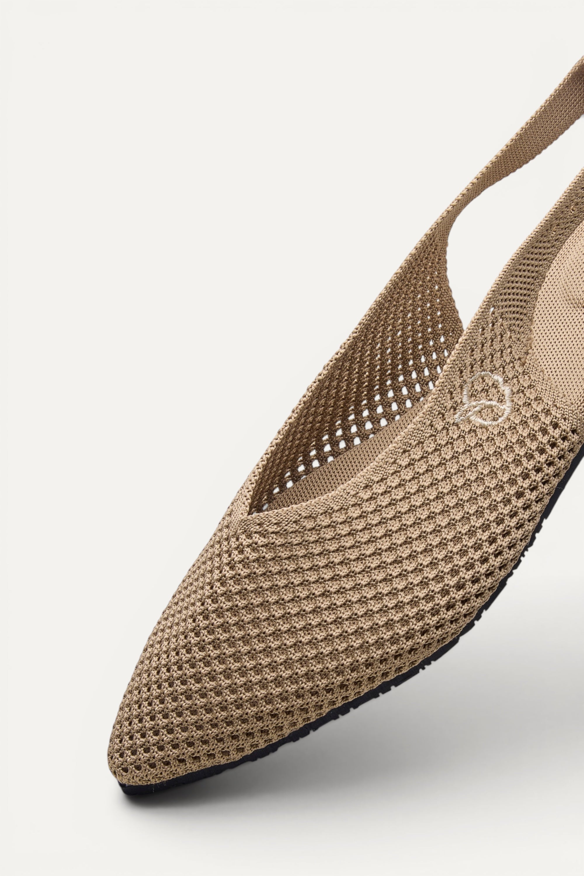 Side view of Rioz Sand Airknit Slingbacks, sleek pointed-toe knit flats with open-mesh upper.