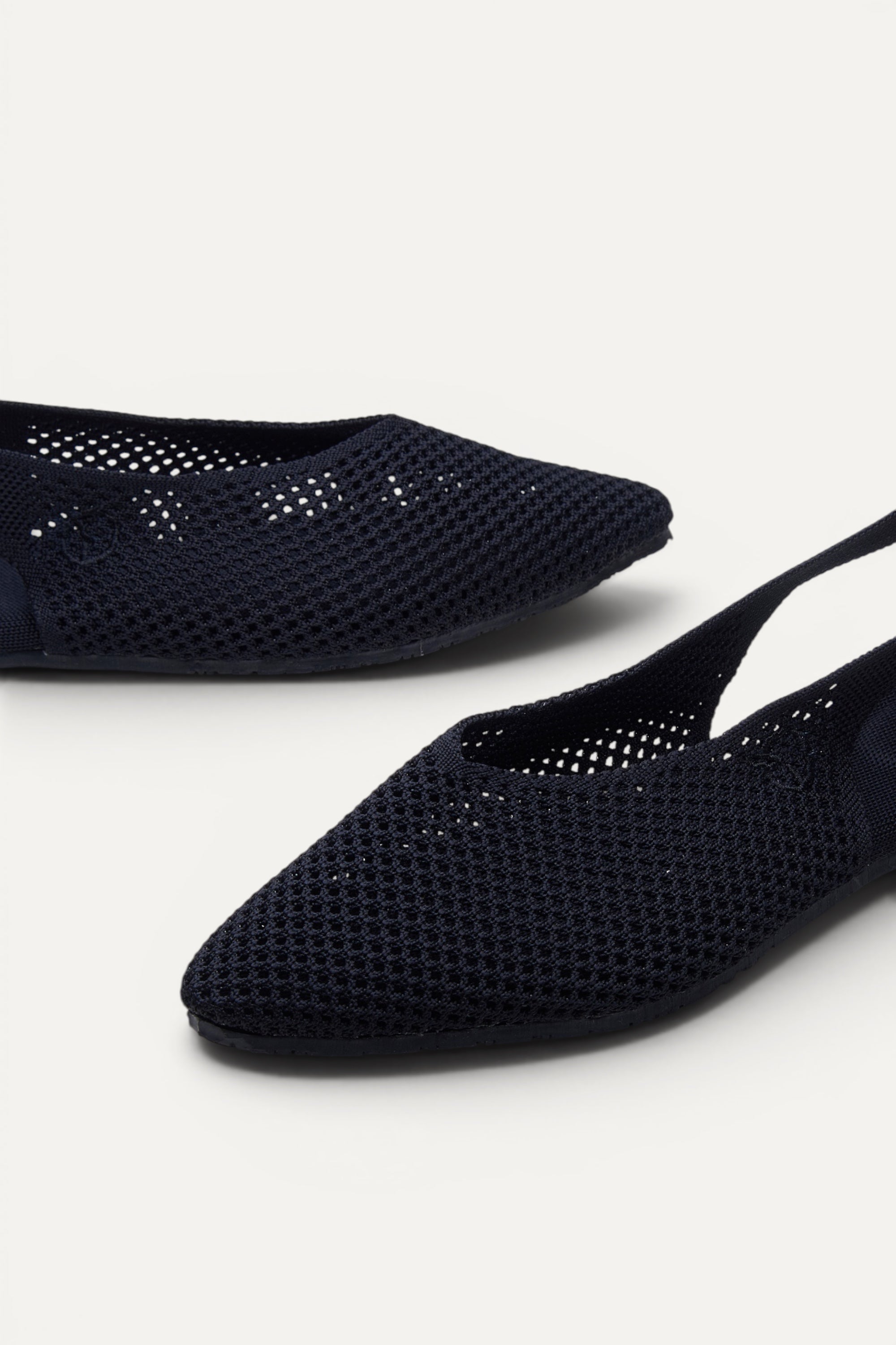 Top view of Rioz Airknit Slingbacks (black, pointed-toe), lightweight knit flats from rPET bottles.