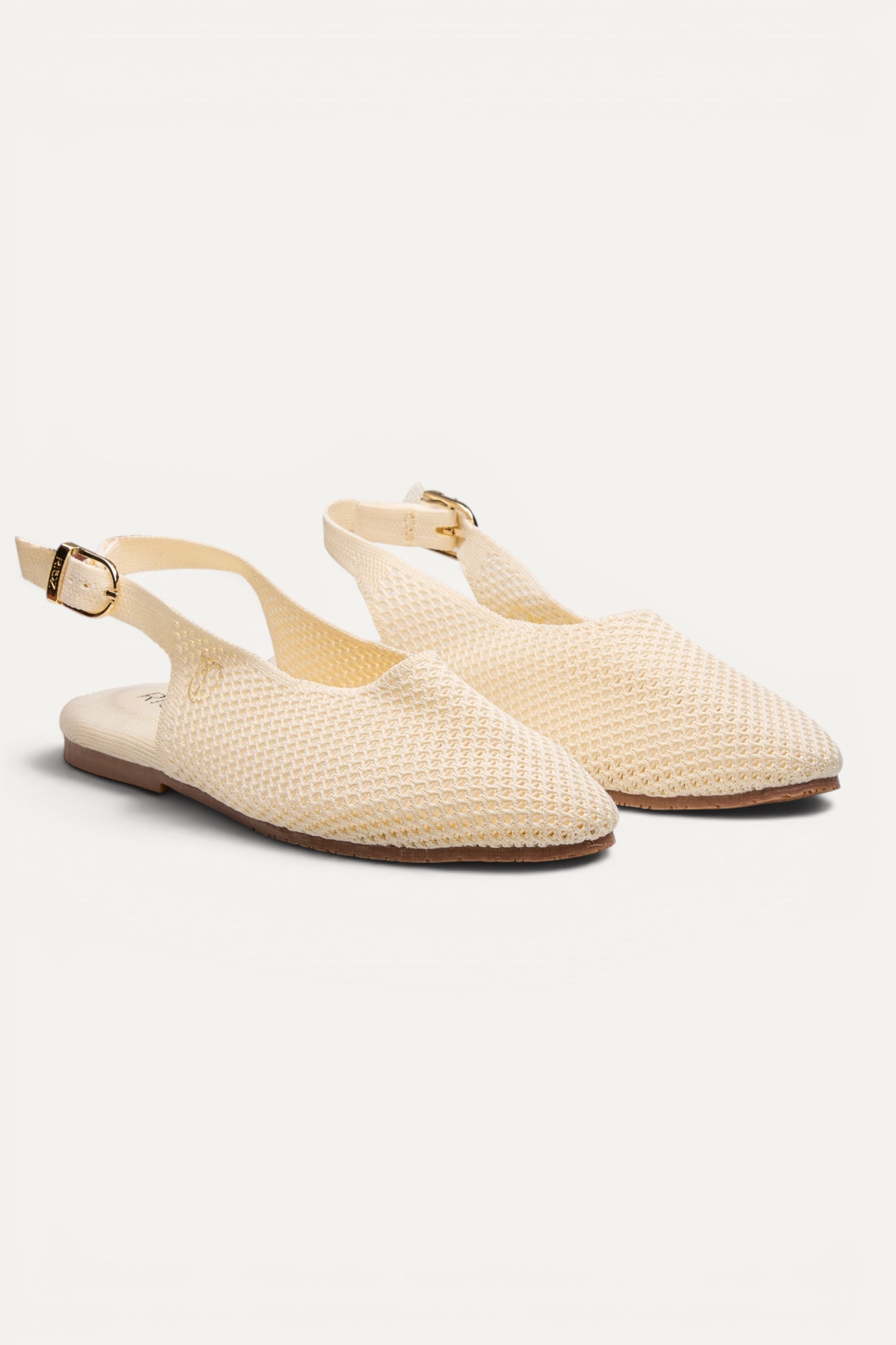 Rioz Airknit Slingbacks in ivory, vegan almond-toe knit flats from recycled PET bottles, made in India.