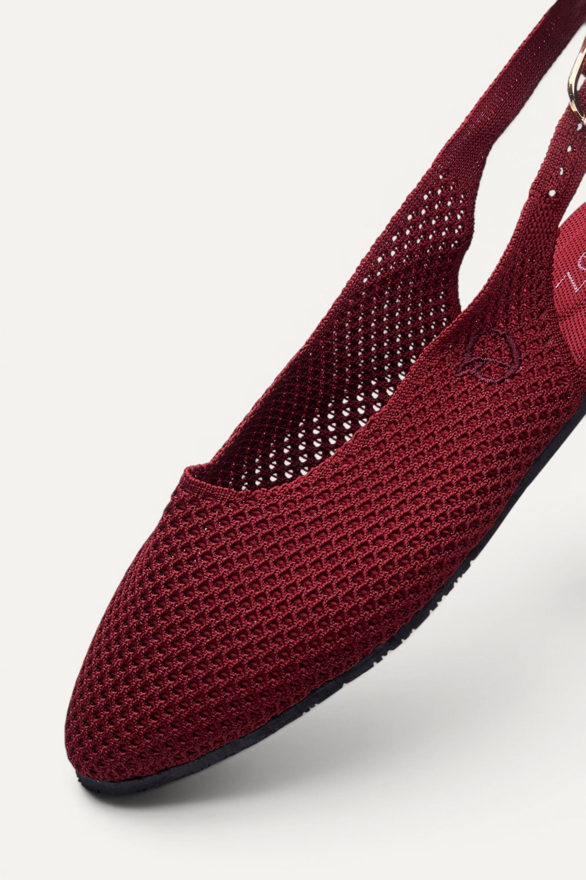 Side view of Rioz Maroon Airknit Slingbacks, breathable open-mesh almond-toe knit flats for women.
