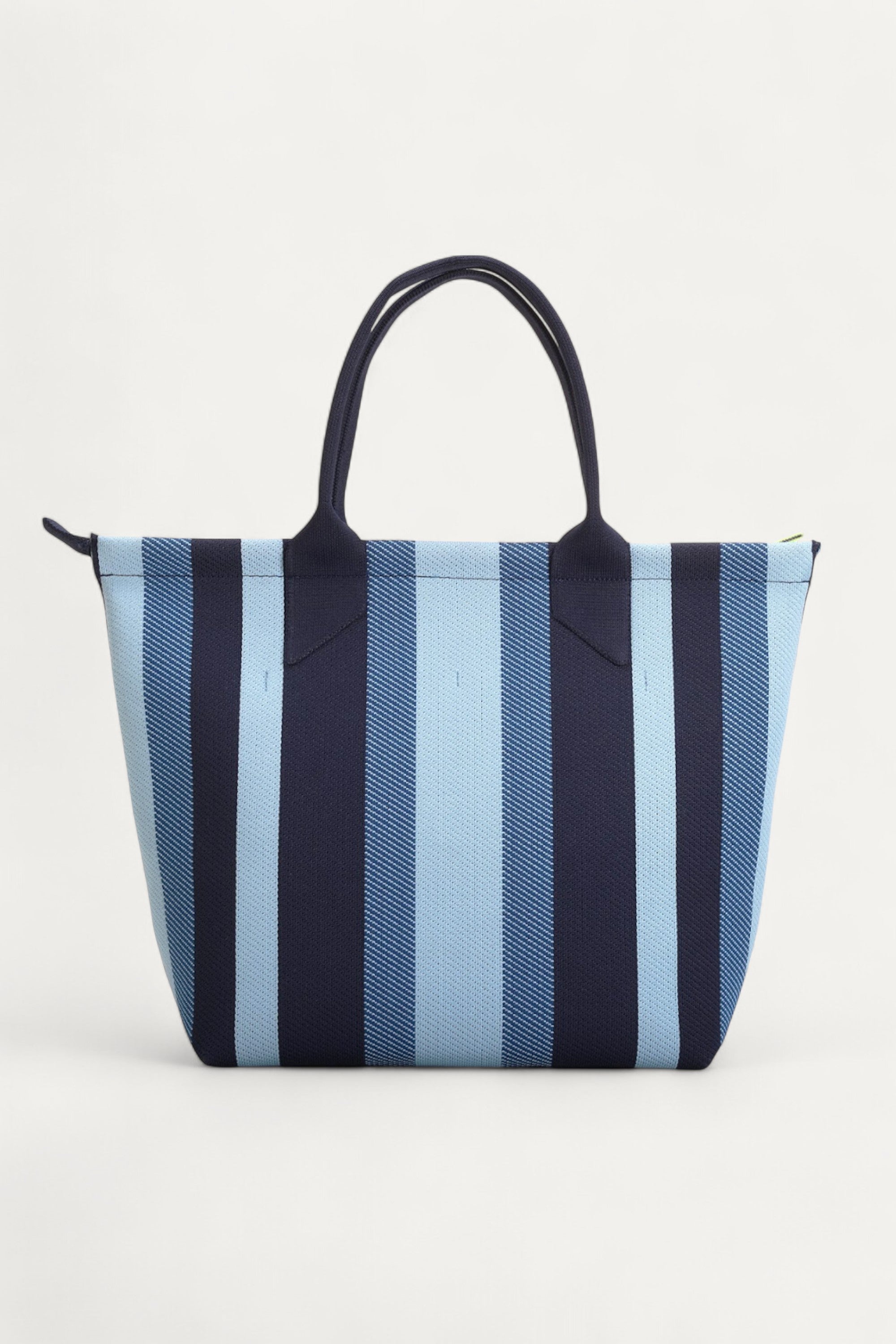 rioz-Eco-friendly zipper tote bag for women—sustainable, spacious, and made from recycled materials, ideal for everyday use and conscious living.