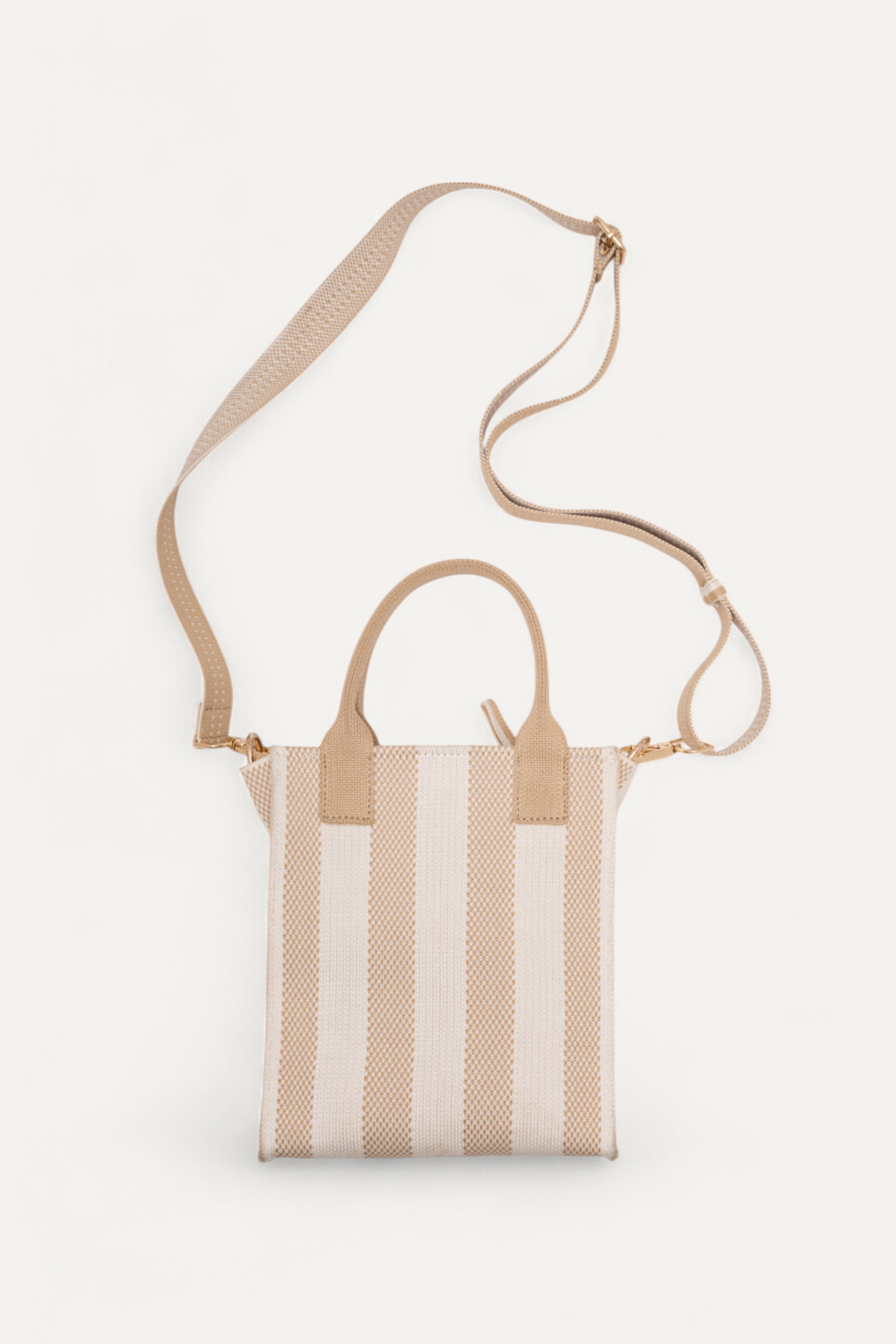 Back view of the Midday Mini tote bag in ivory and wheat stripes by Rioz with adjustable strap; compact, eco-friendly and lightweight bag for daily use.