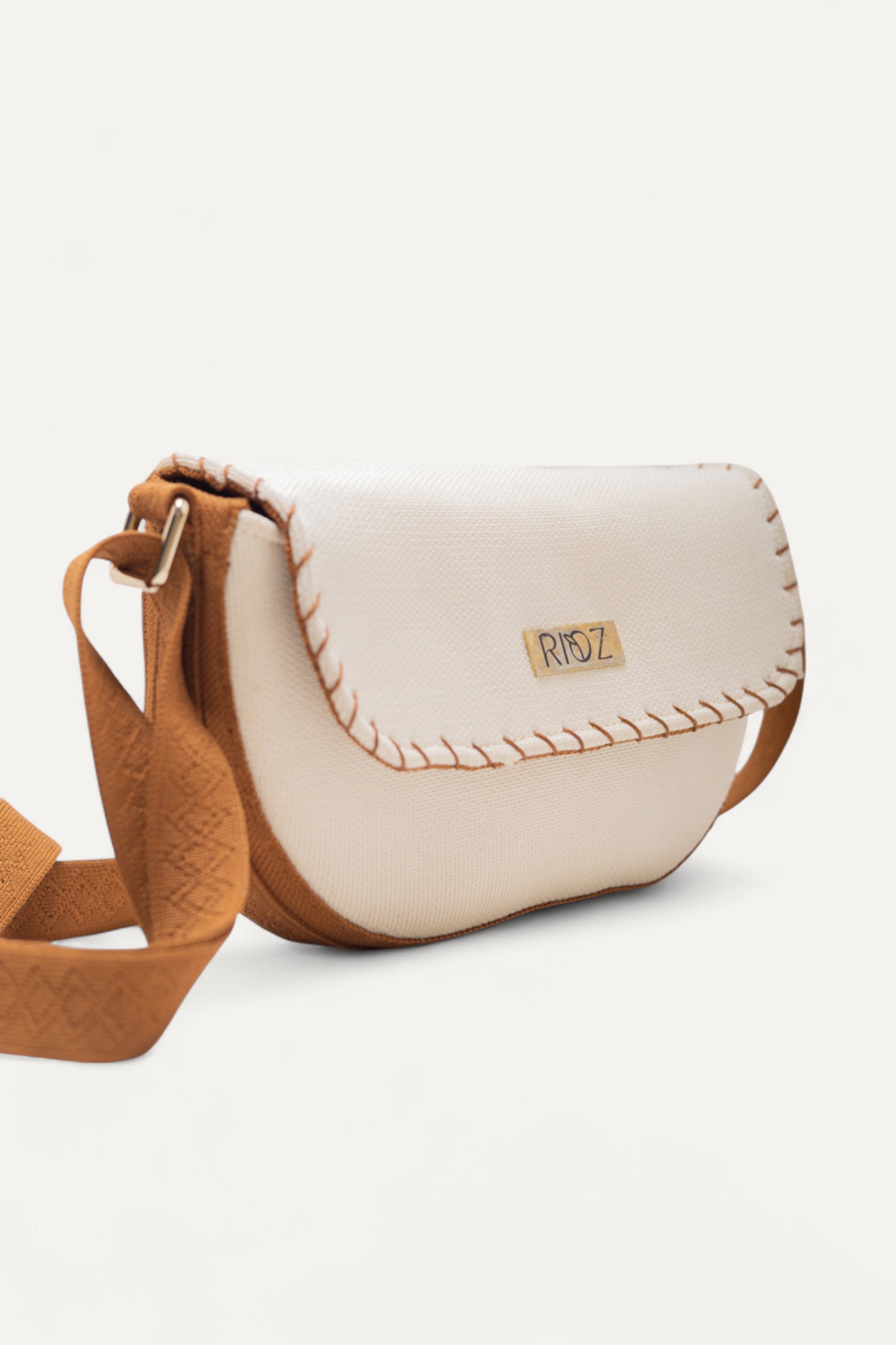 RIOZ-Eco-friendly saddle bag with crossbody strap—compact, stylish, and crafted from sustainable materials, ideal for everyday essentials and hands-free use