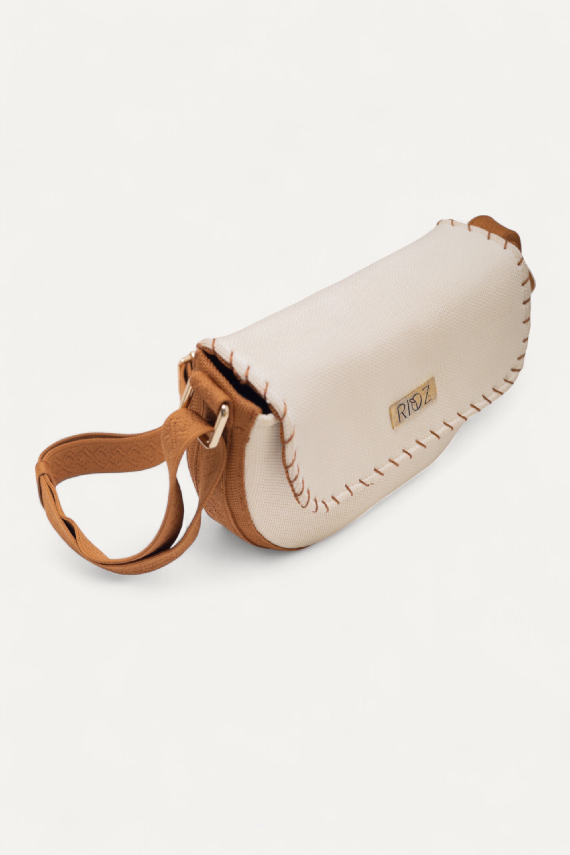RIOZ-Eco-friendly saddle bag with crossbody strap—compact, stylish, and crafted from sustainable materials, ideal for everyday essentials and hands-free use
