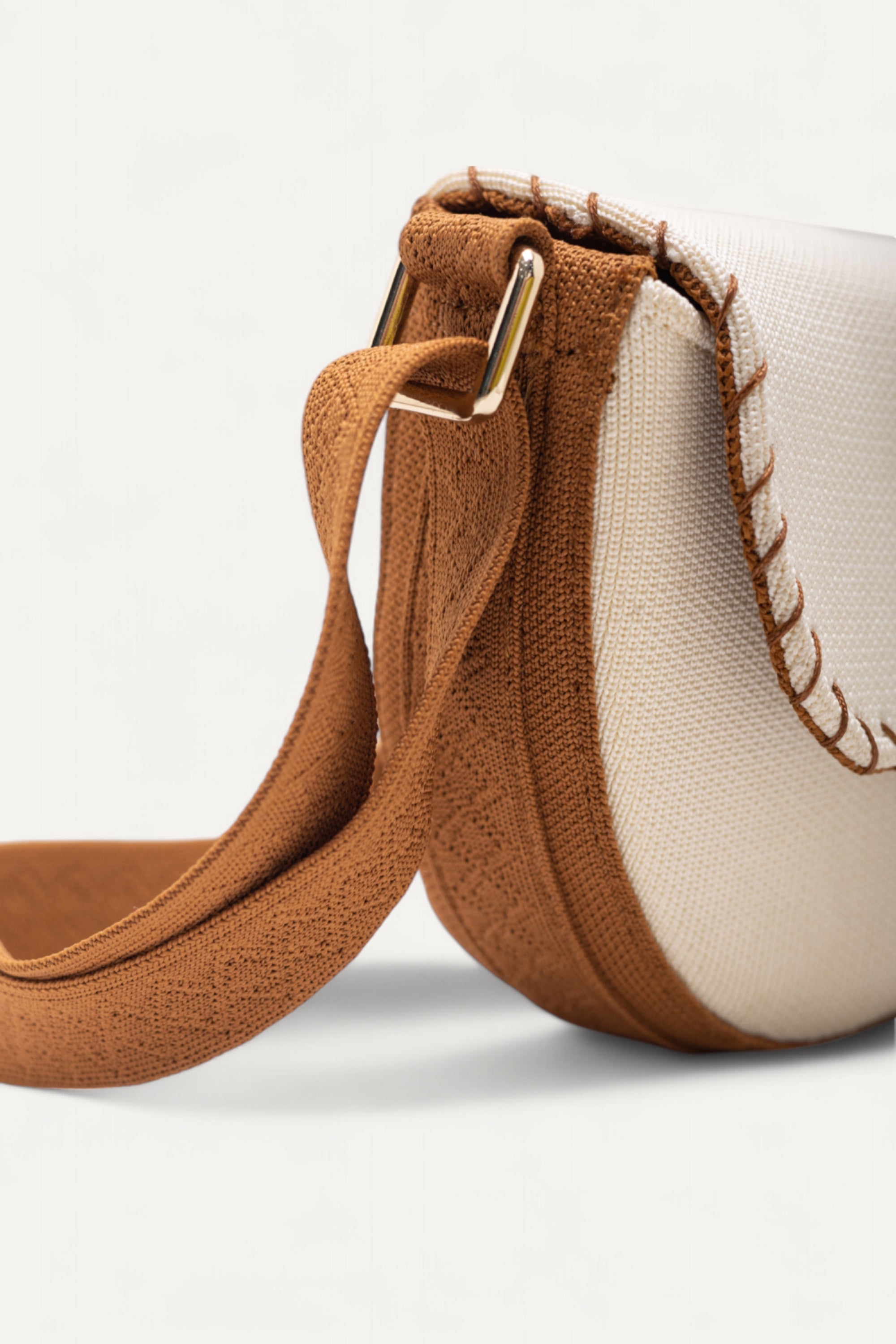 RIOZ-Eco-friendly saddle bag with crossbody strap—compact, stylish, and crafted from sustainable materials, ideal for everyday essentials and hands-free use
