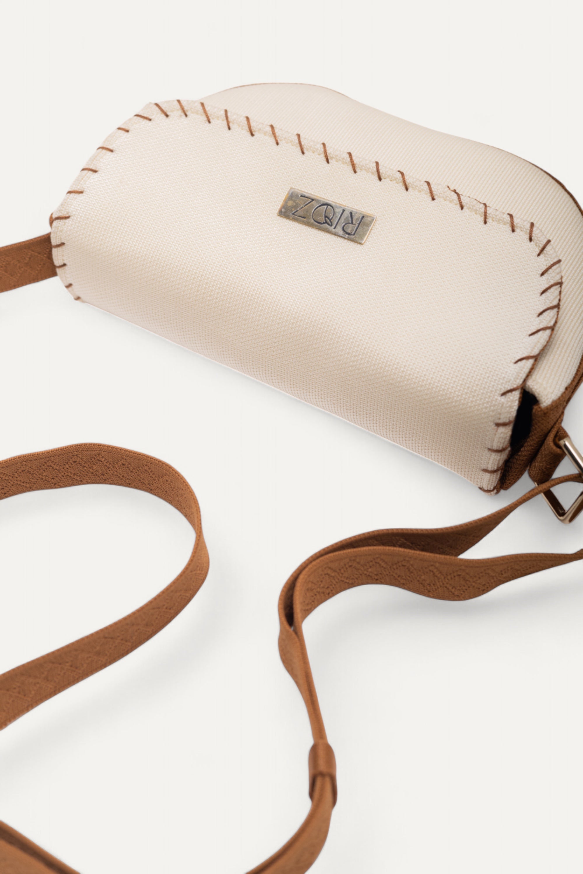RIOZ-Eco-friendly saddle bag with crossbody strap—compact, stylish, and crafted from sustainable materials, ideal for everyday essentials and hands-free use