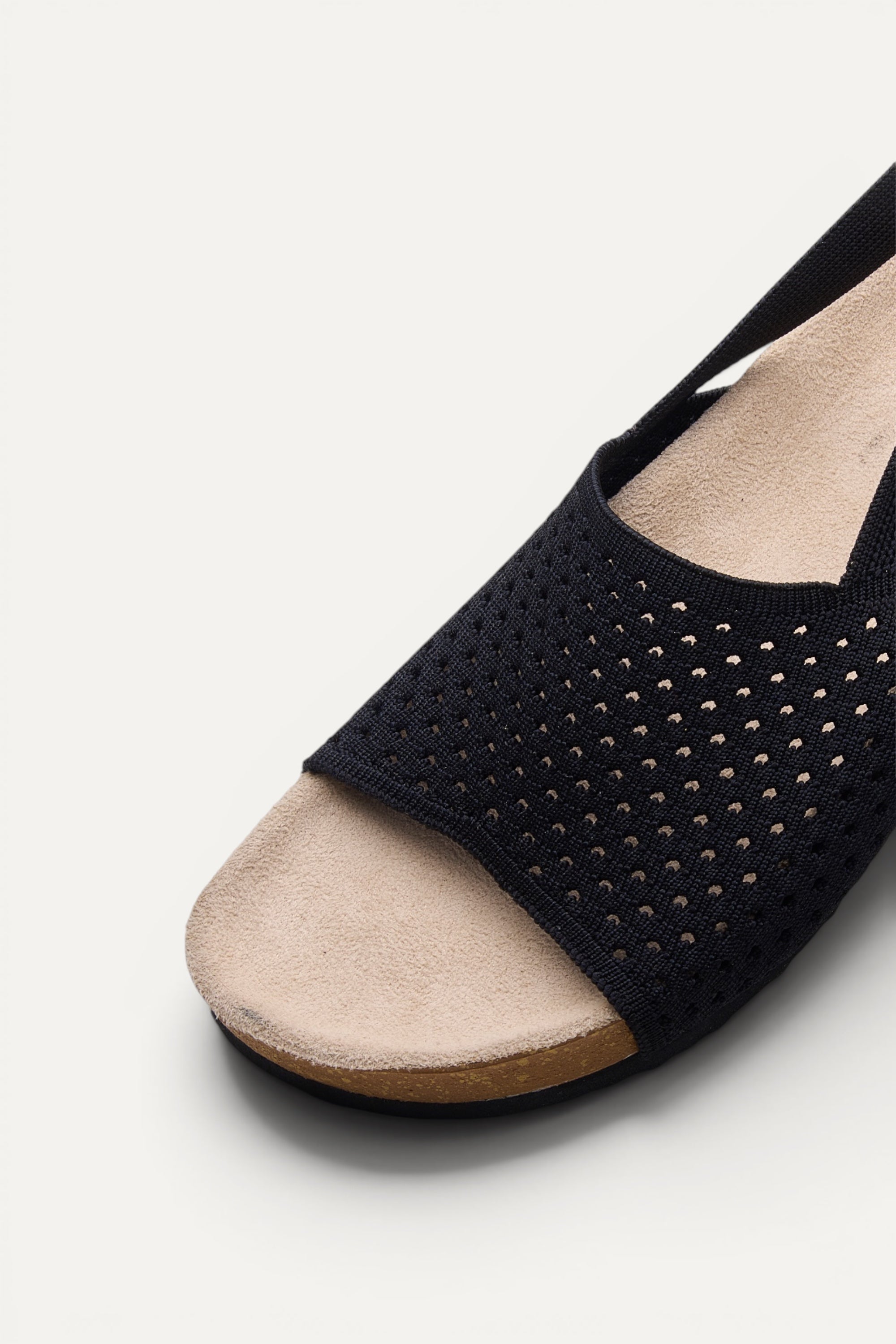 Side view of Rioz Black Mira Sandals, breathable knit slingback sandals with cushioned footbed.
