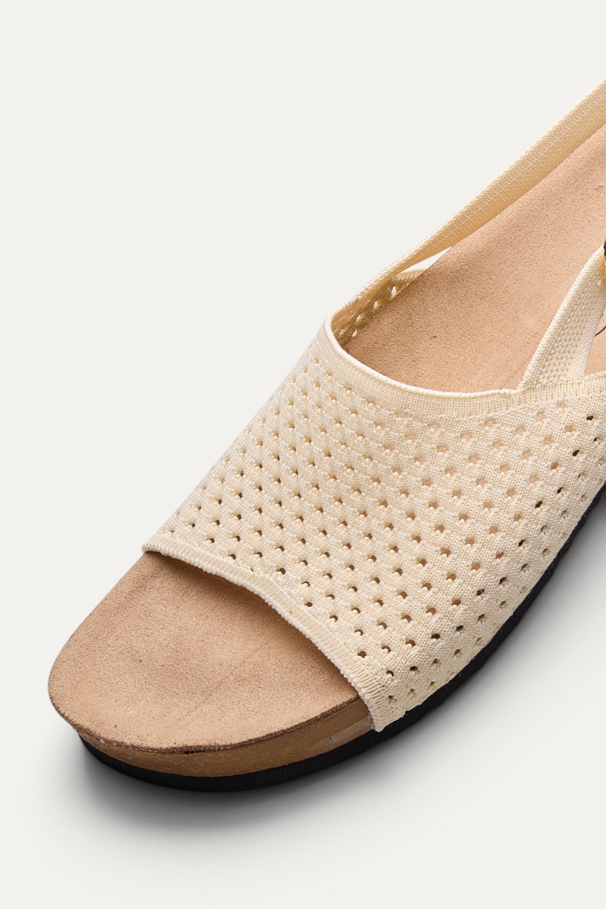 Side view of Rioz Ivory Mira Sandals, breathable knit slingback sandals with cushioned footbed.