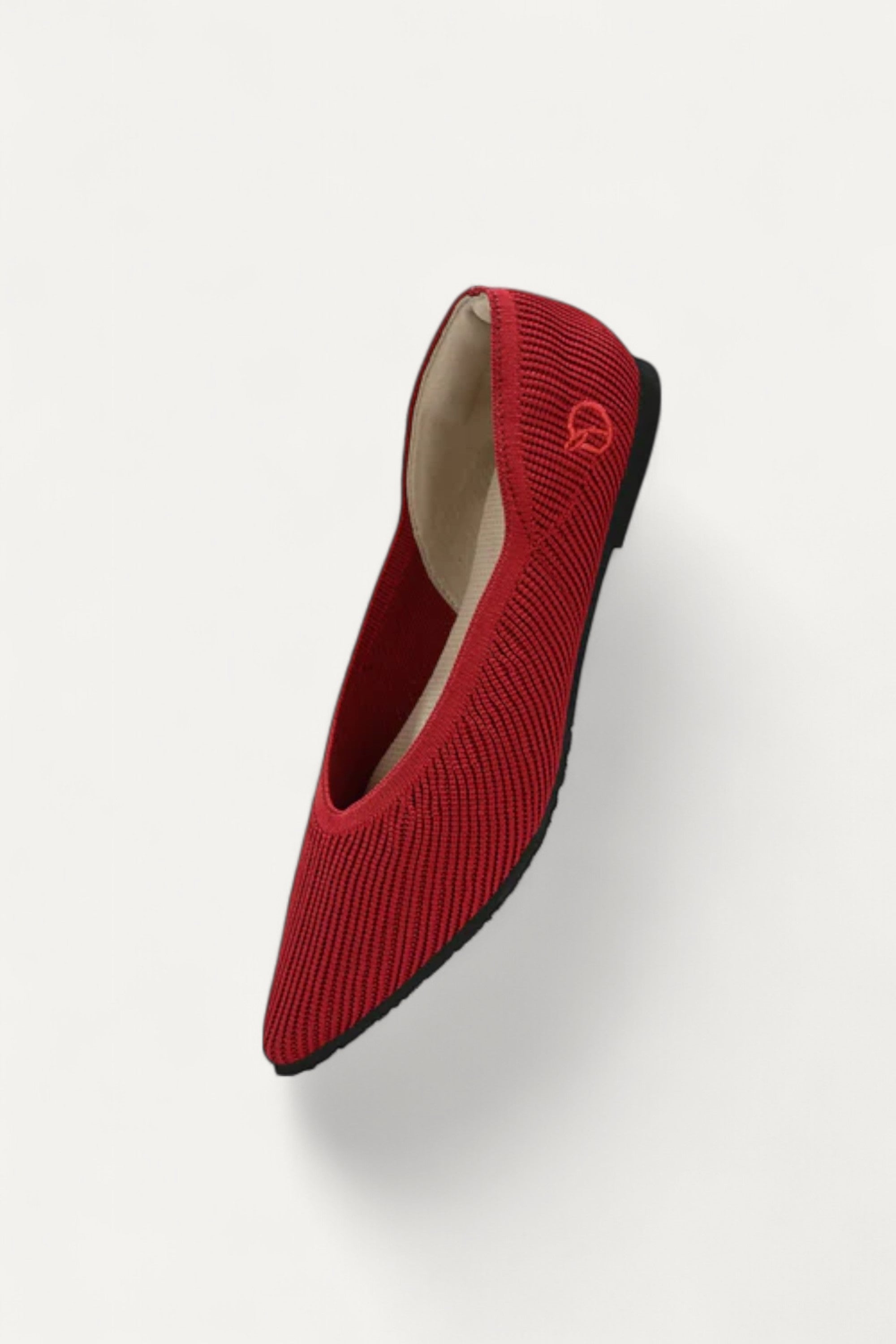 Red pointed-toe ballet flat made from recycled plastic bottles