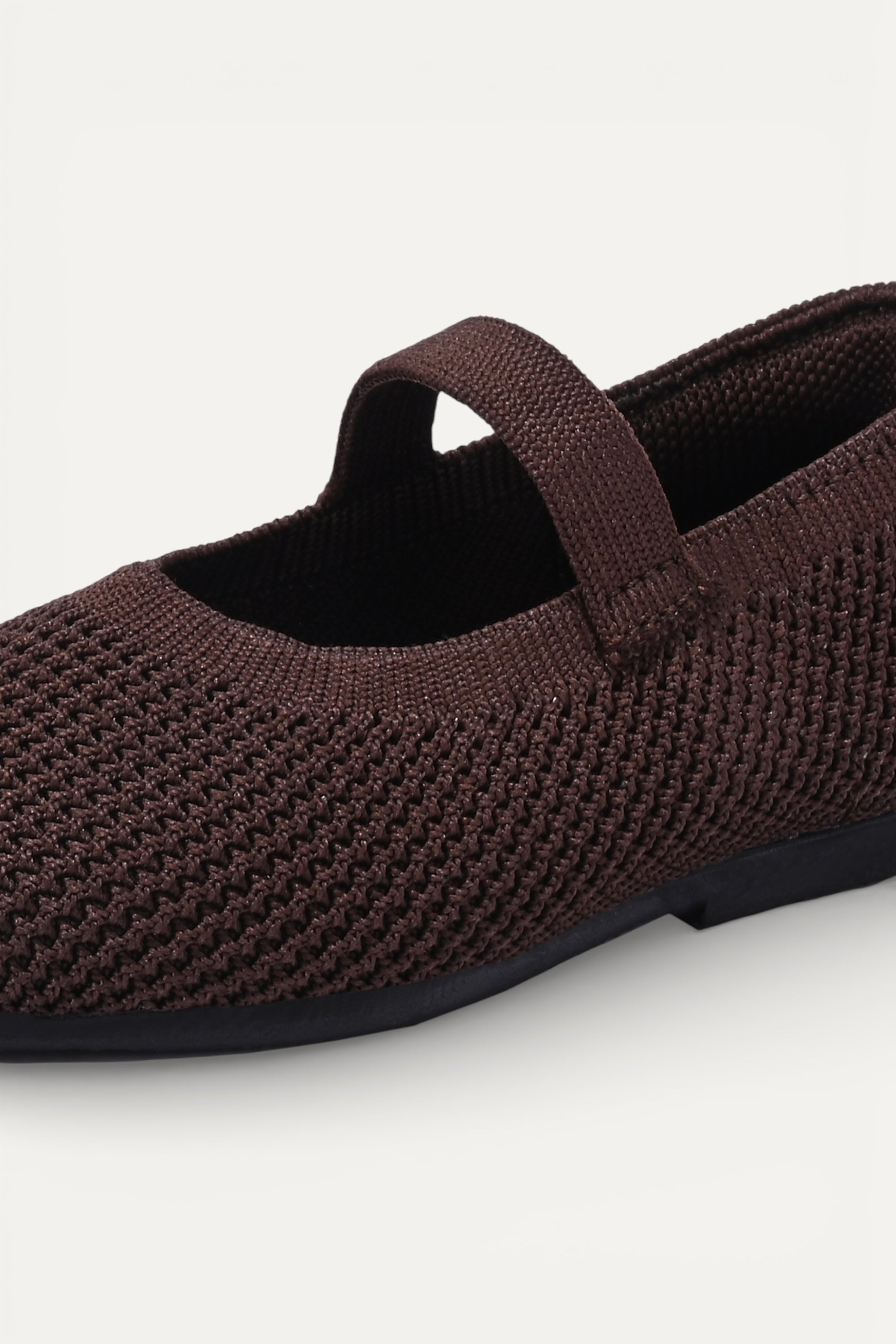 Kids Brown knit Mary Jane shoes with black strap, made using zero-waste 3D knitting from recycled PET (rPET) plastic bottles, lightweight breathable round-toe flats for everyday wear.