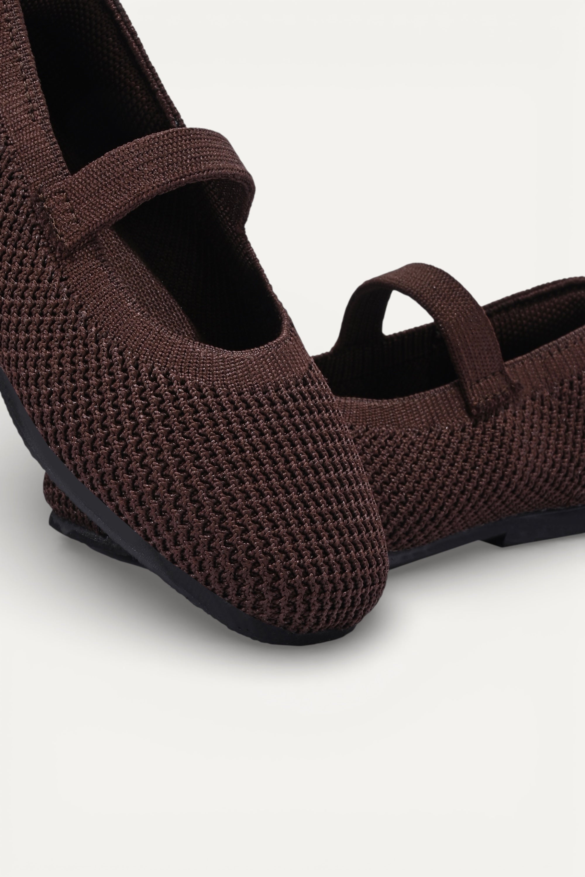 Kids Brown knit Mary Jane shoes with black strap, made using zero-waste 3D knitting from recycled PET (rPET) plastic bottles, lightweight breathable round-toe flats for everyday wear.