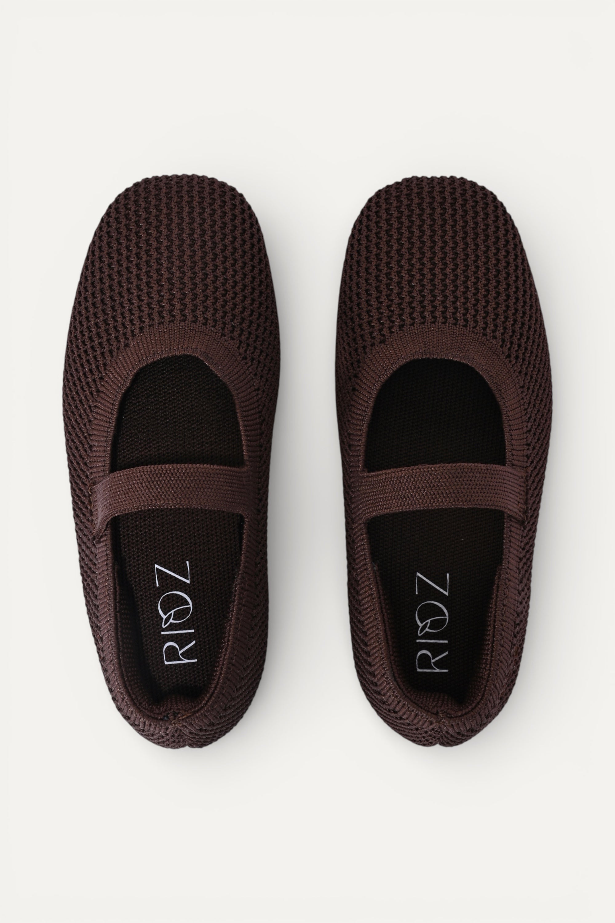 Kids Brown knit Mary Jane shoes with black strap, made using zero-waste 3D knitting from recycled PET (rPET) plastic bottles, lightweight breathable round-toe flats for everyday wear.