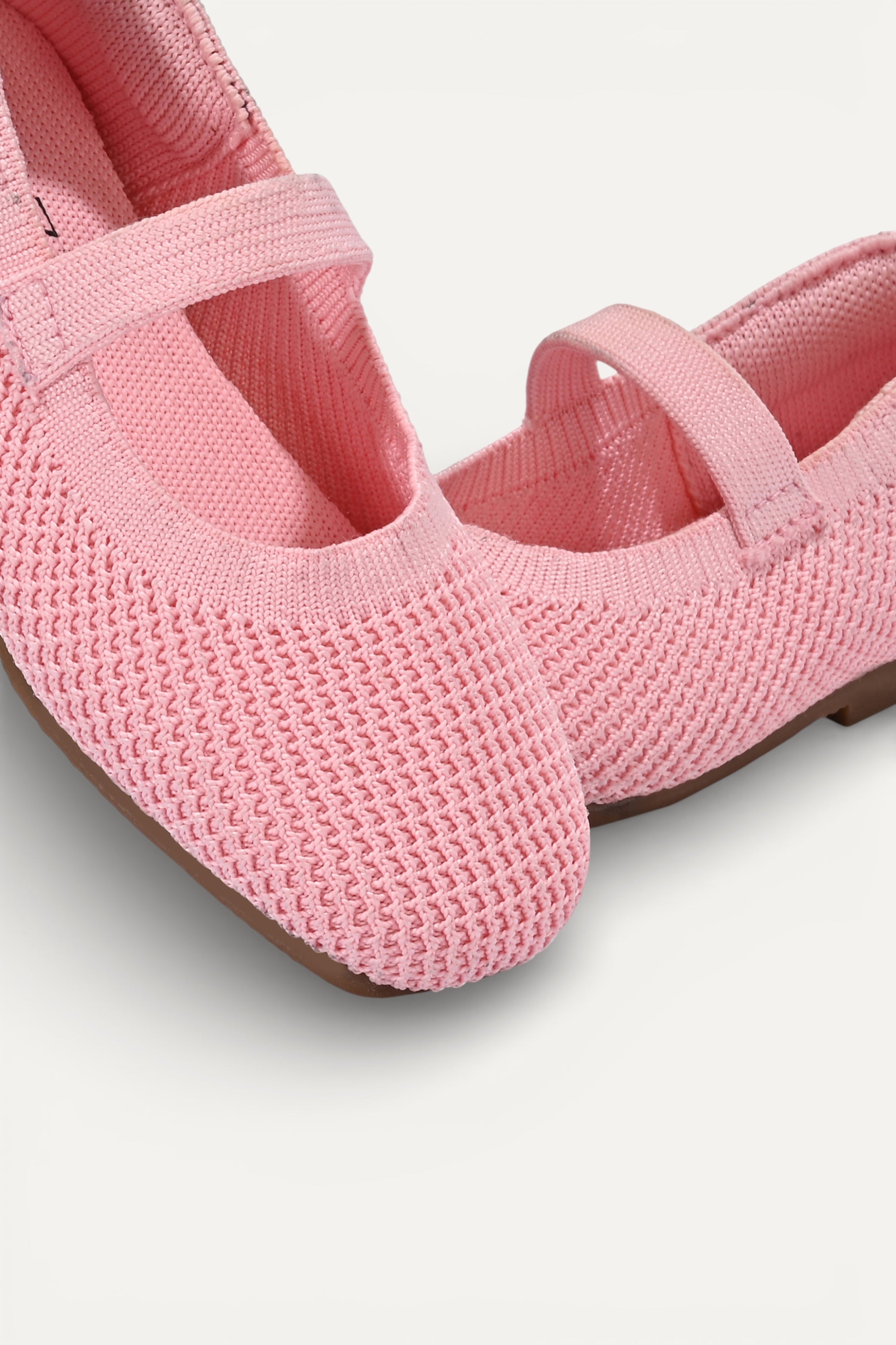Kids Baby Pink knit Mary Jane shoes with black strap, made using zero-waste 3D knitting from recycled PET (rPET) plastic bottles, lightweight breathable round-toe flats for everyday wear.