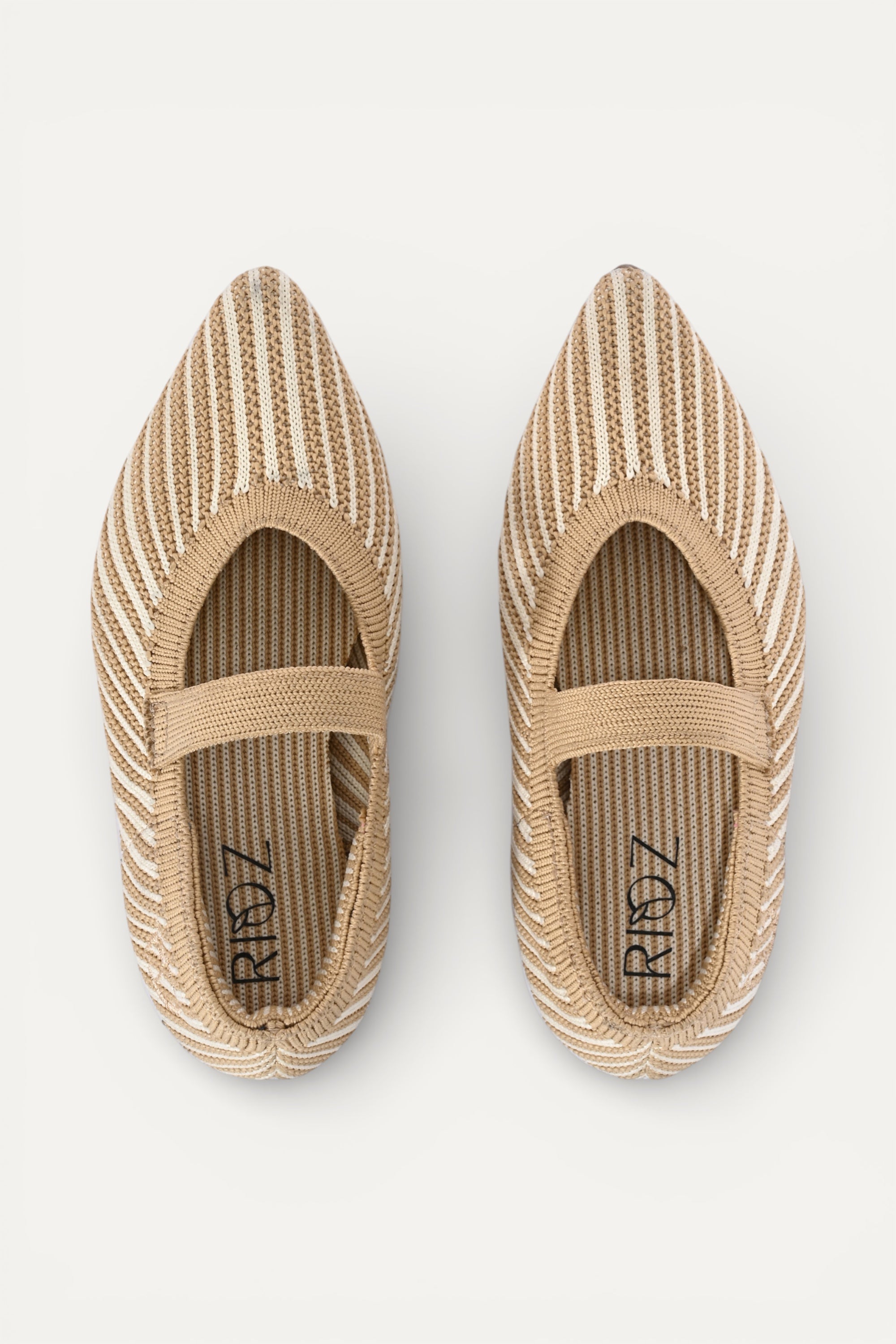 Beige and cream knit Mary Jane flats with strap, breathable striped pattern upper, lightweight flexible sole, comfortable everyday footwear for kids.
