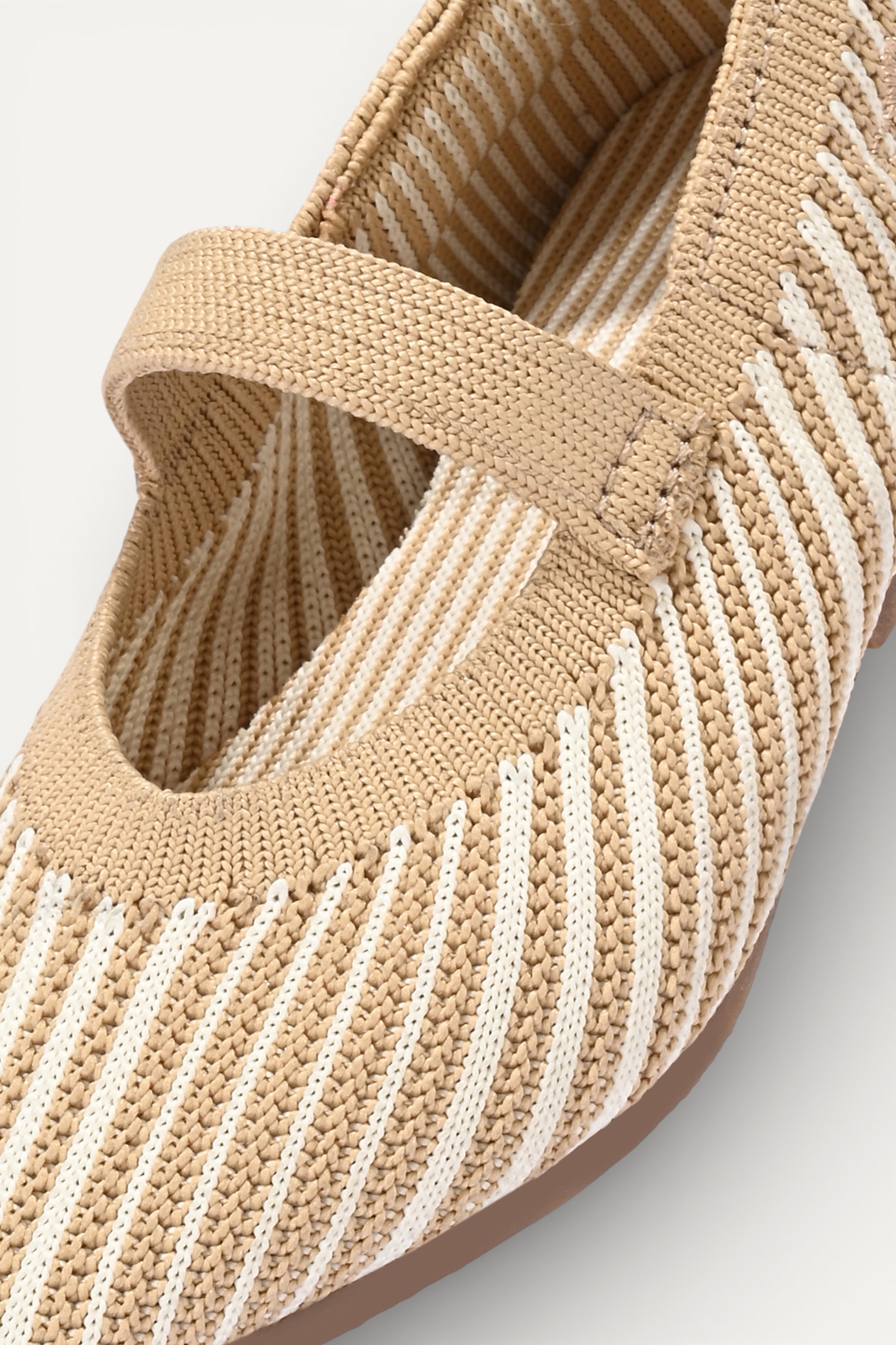 Beige and cream knit Mary Jane flats with strap, breathable striped pattern upper, lightweight flexible sole, comfortable everyday footwear for kids.