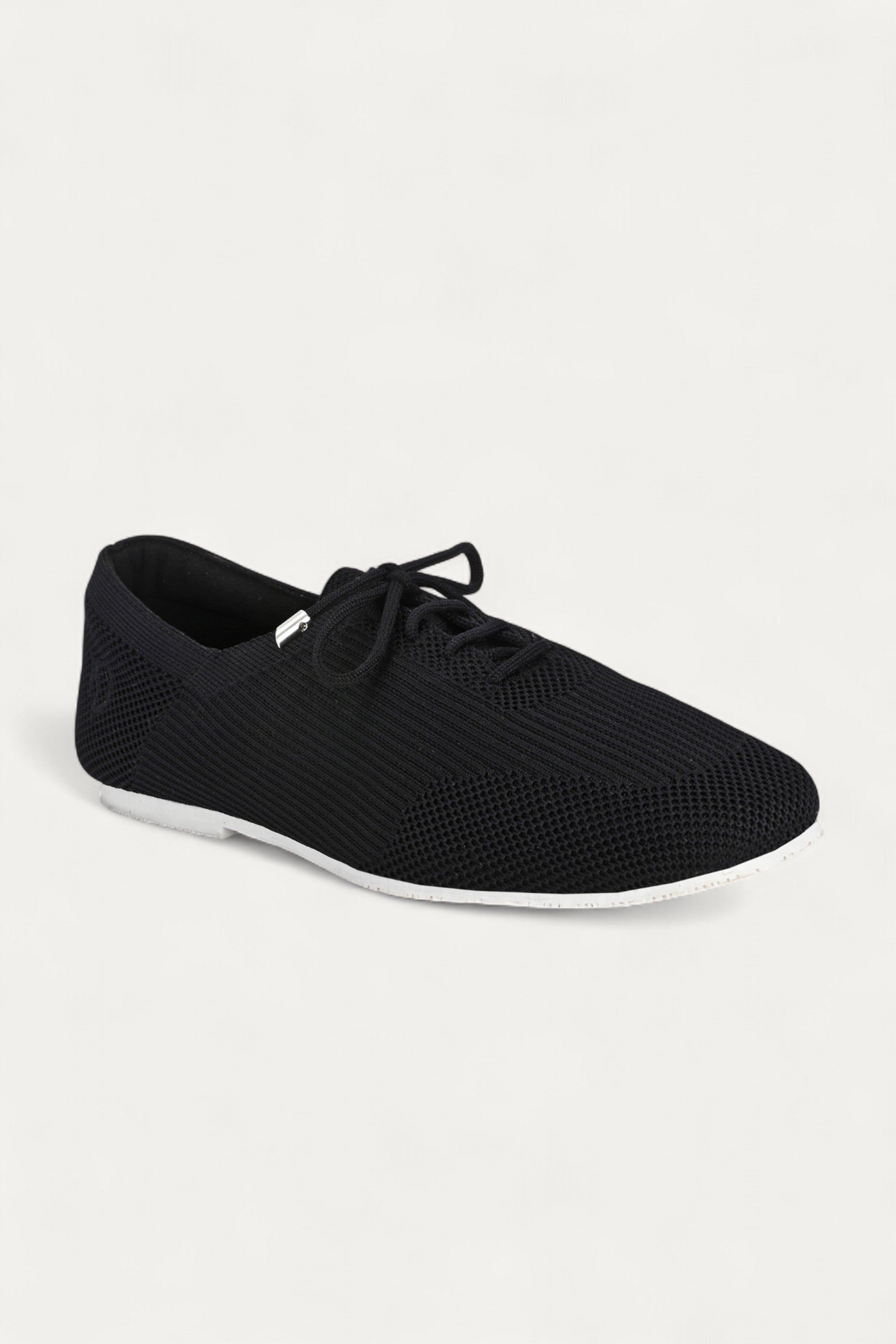 Rioz black knitted lace-up shoes with breathable mesh design, lightweight casual sneakers for women with flexible sole, angled view on neutral background.