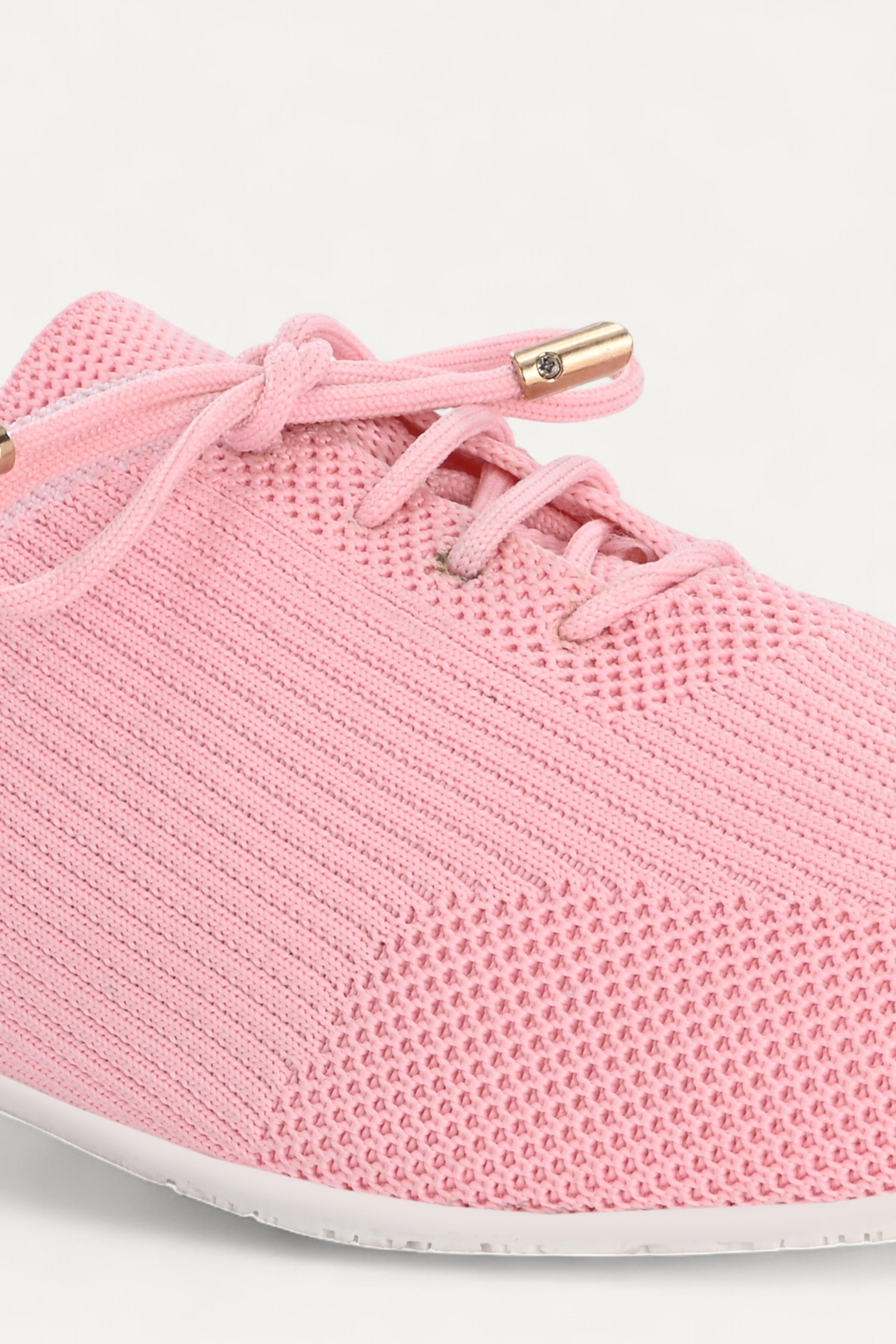 Rioz pink knit sneakers for women with breathable mesh design, lace-up closure, and white sole