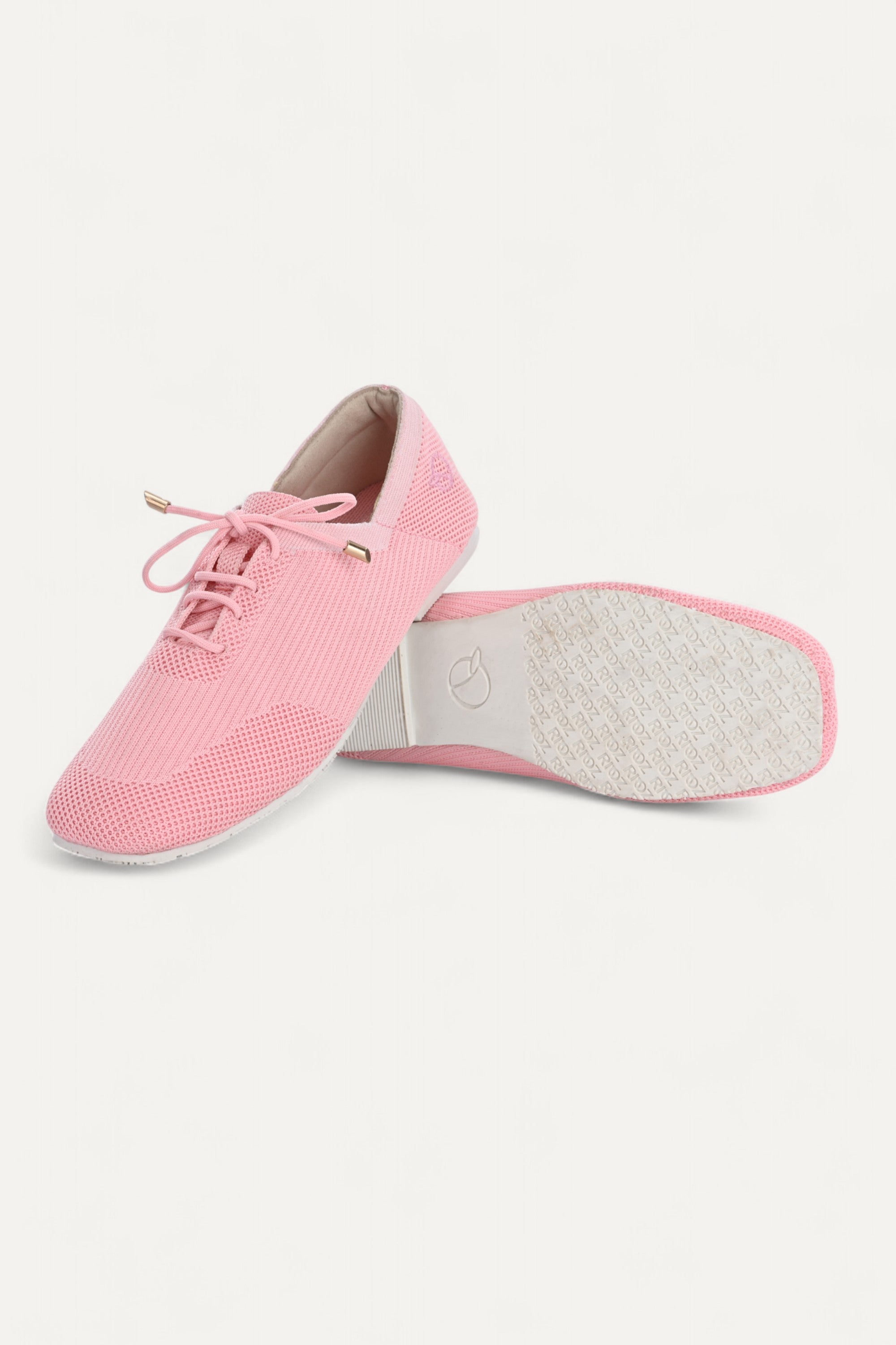 Rioz pink knit sneakers for women with breathable mesh design, lace-up closure, and white sole
