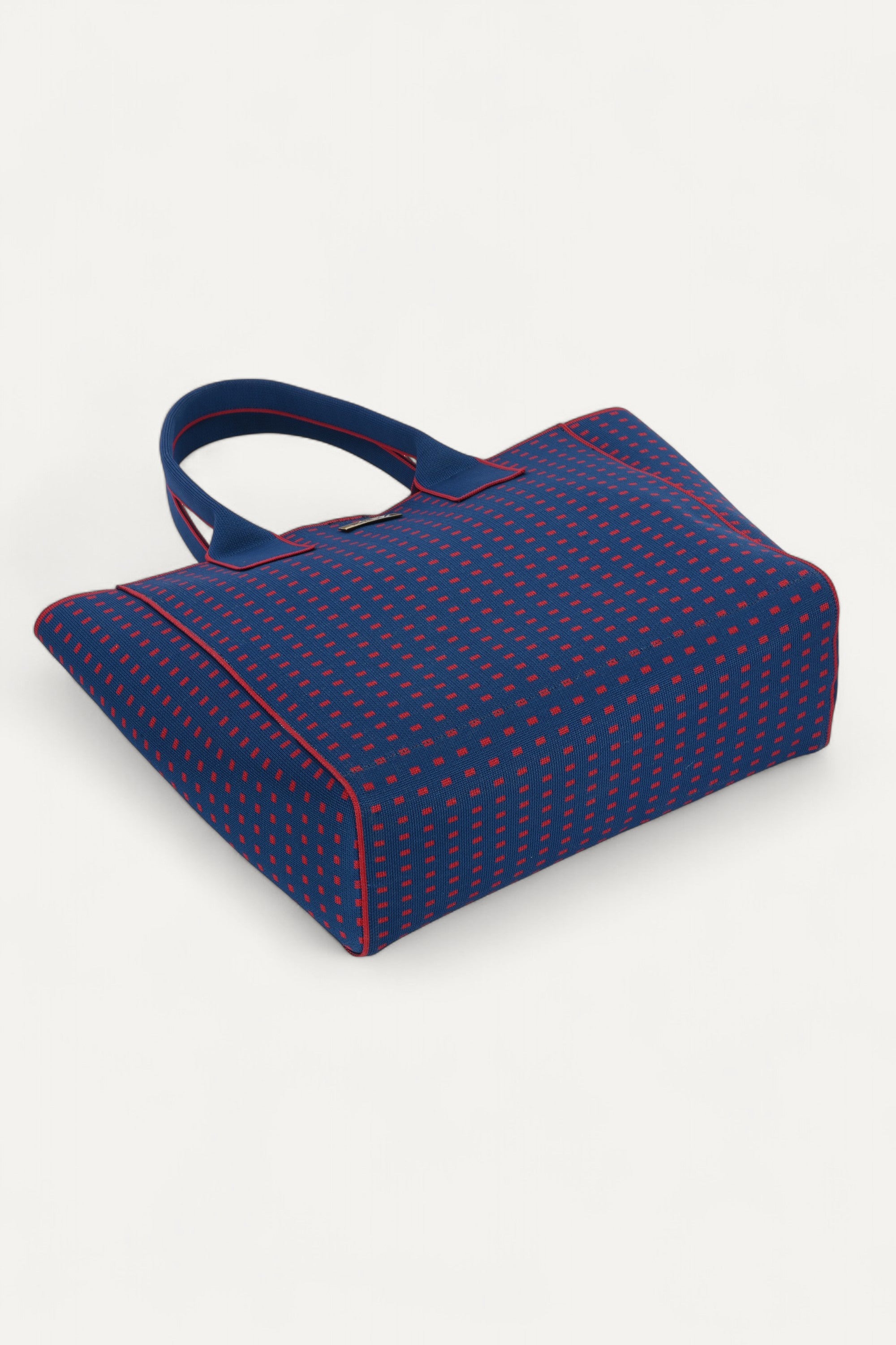 Eco-friendly backpack by Rioz blue and red bag, stylish textured handbag for women