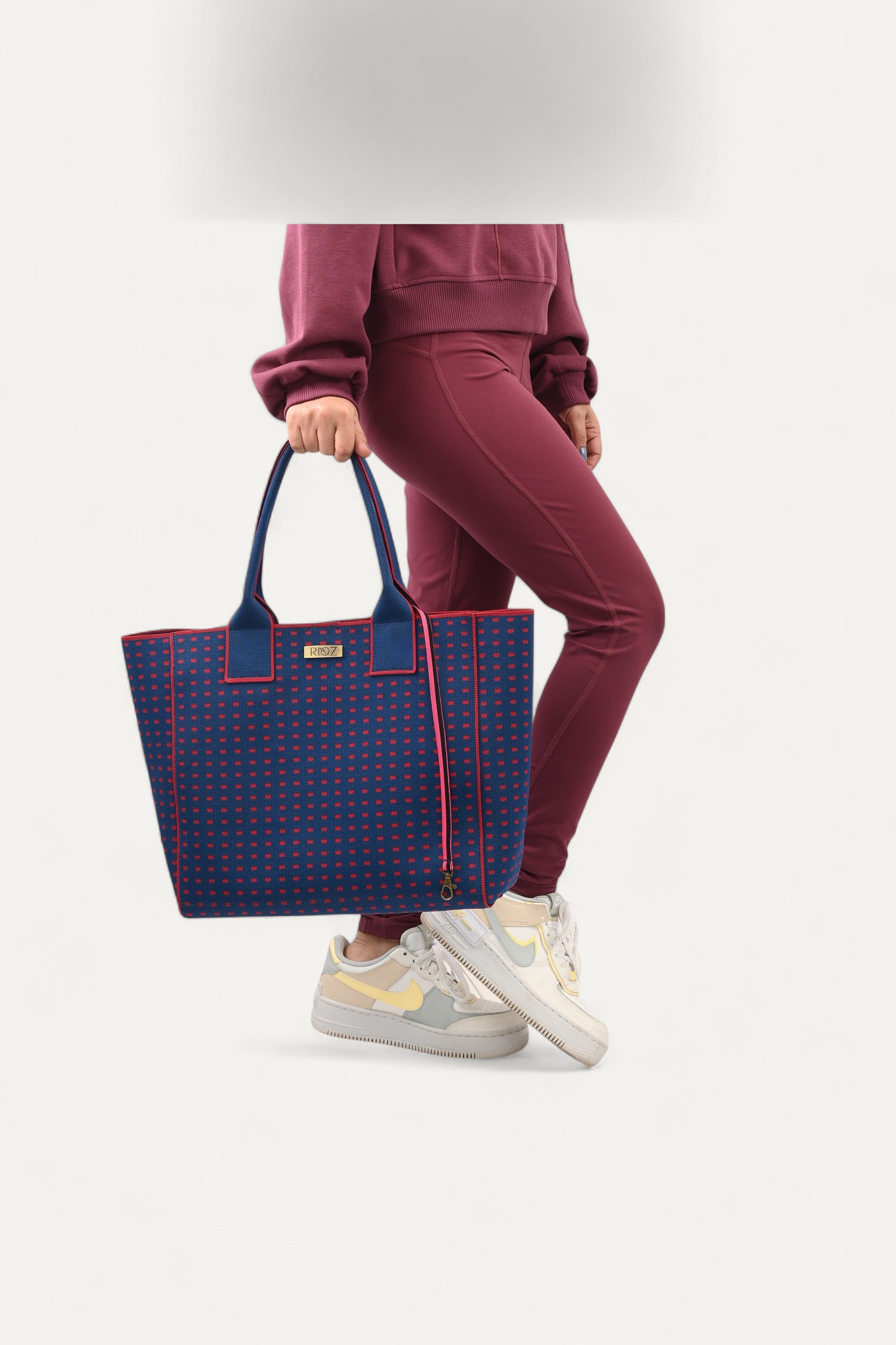 Eco-friendly backpack by Rioz blue and red crossbody bag, stylish textured handbag for women