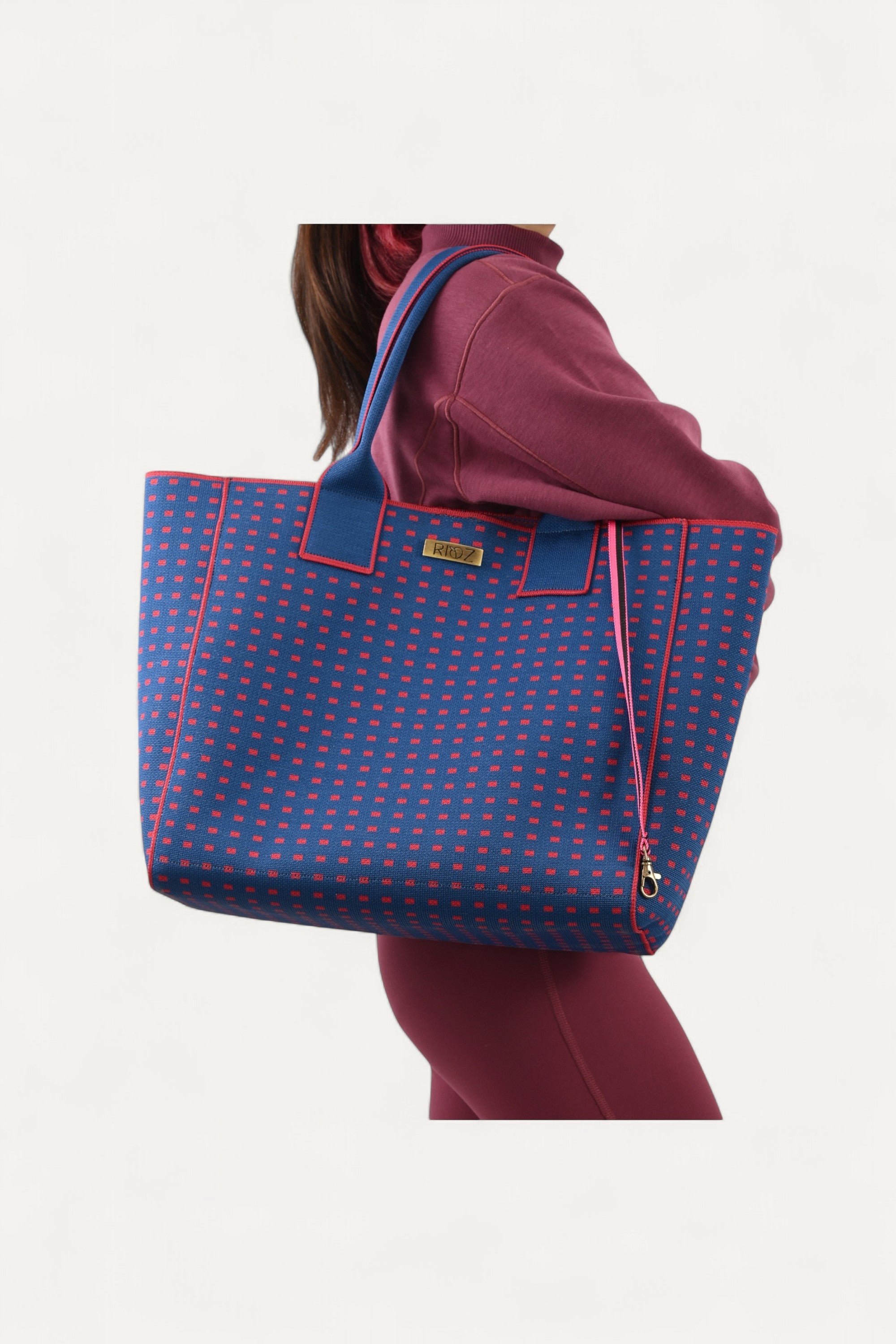 Eco-friendly backpack by Rioz blue and red crossbody bag, stylish textured handbag for women