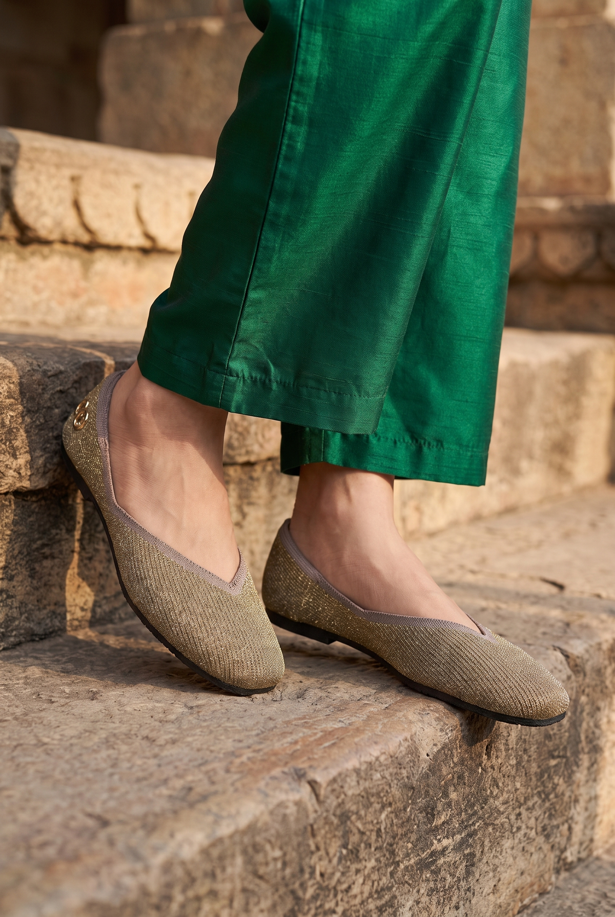 Sitara Juttis Taupe Gold foot closeup on Indian woman in traditional palazzo