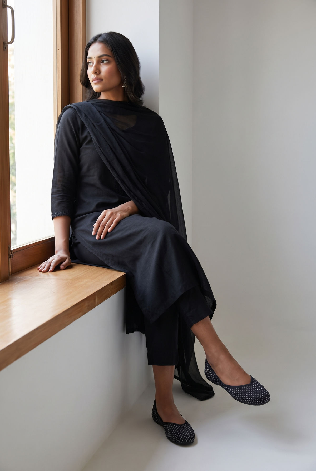 Rioz Noor black silver shimmer jutti worn with a tonal black kurta set