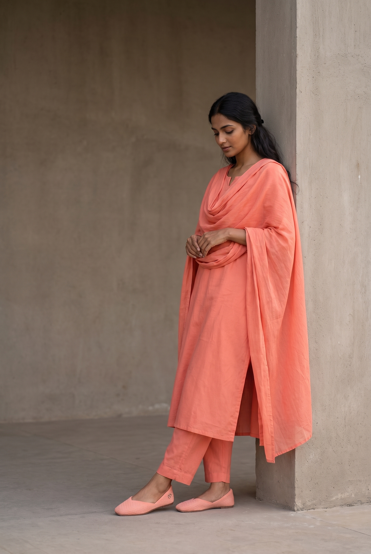 Rioz Noor coral silver shimmer jutti worn with a tonal coral kurta set