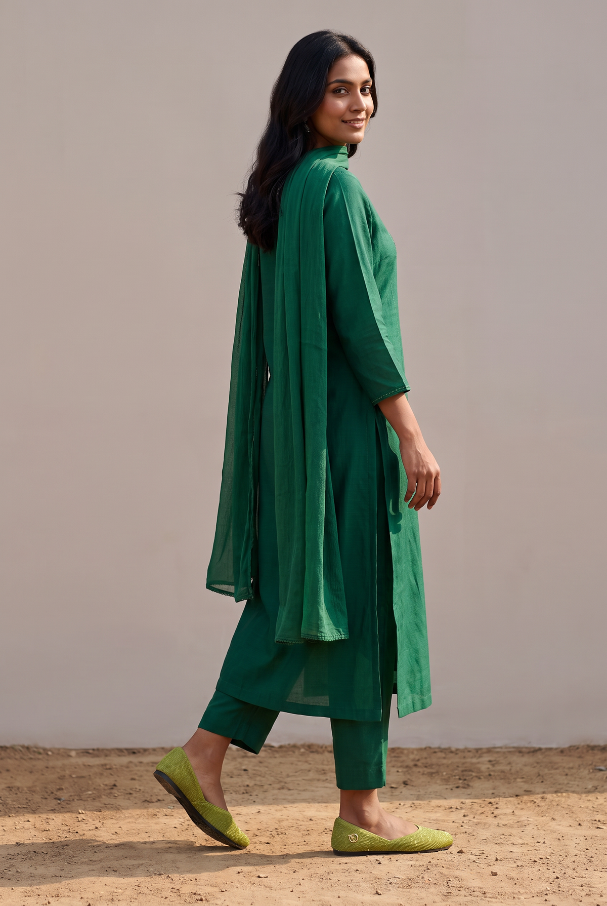 Rioz Lehar green gold shimmer jutti worn with a tonal green kurta set