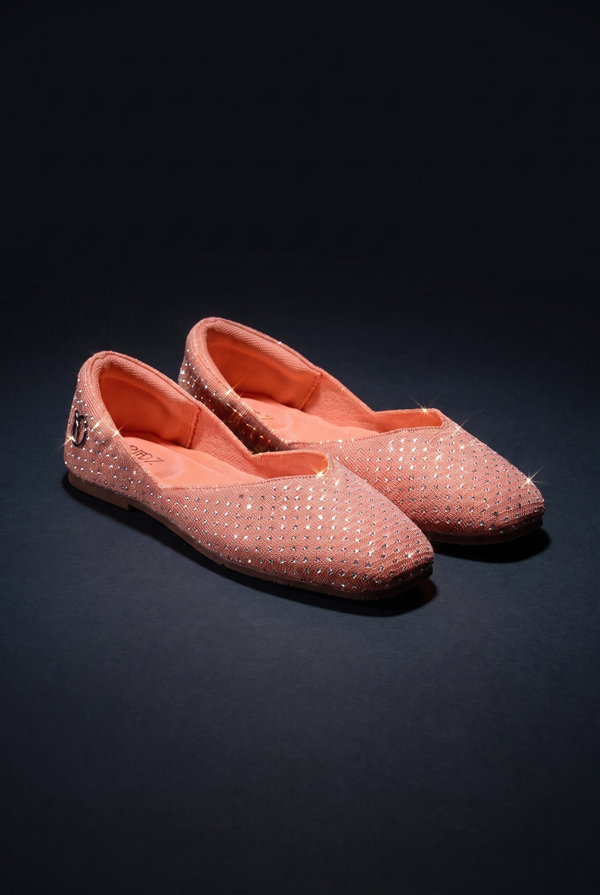 Sitara Juttis Coral Silver shimmer and shape, sparkling jutti pair