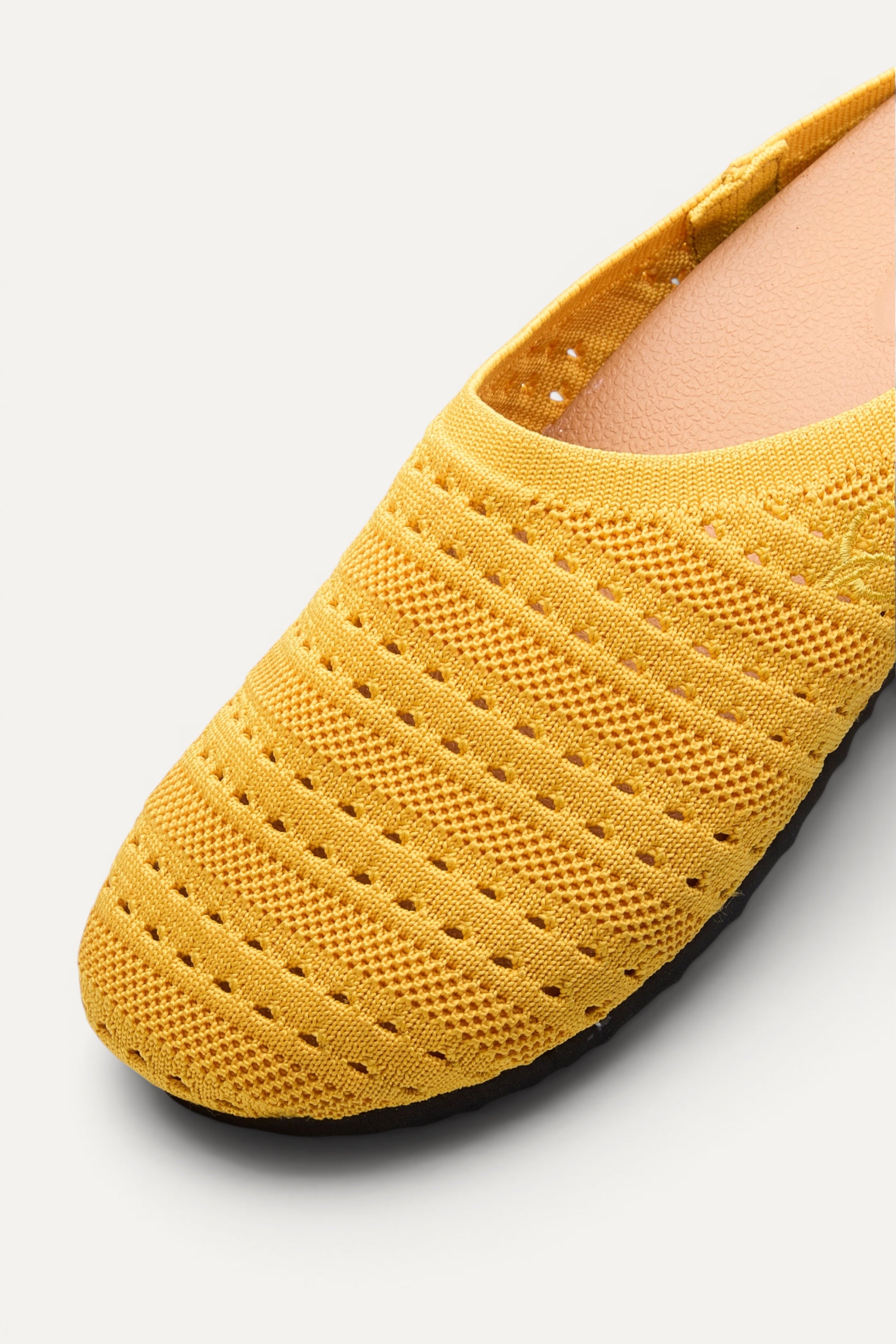 Top view of Rioz Lumi Mules (yellow), lightweight 350g knit clogs made in India from rPET.