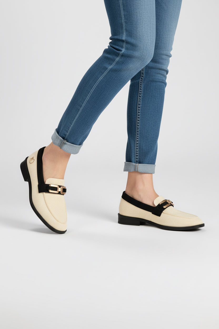 Rioz cream knit slip-on loafers with black trim and gold buckle detail, eco-friendly fabric and cushioned sole casual shoes