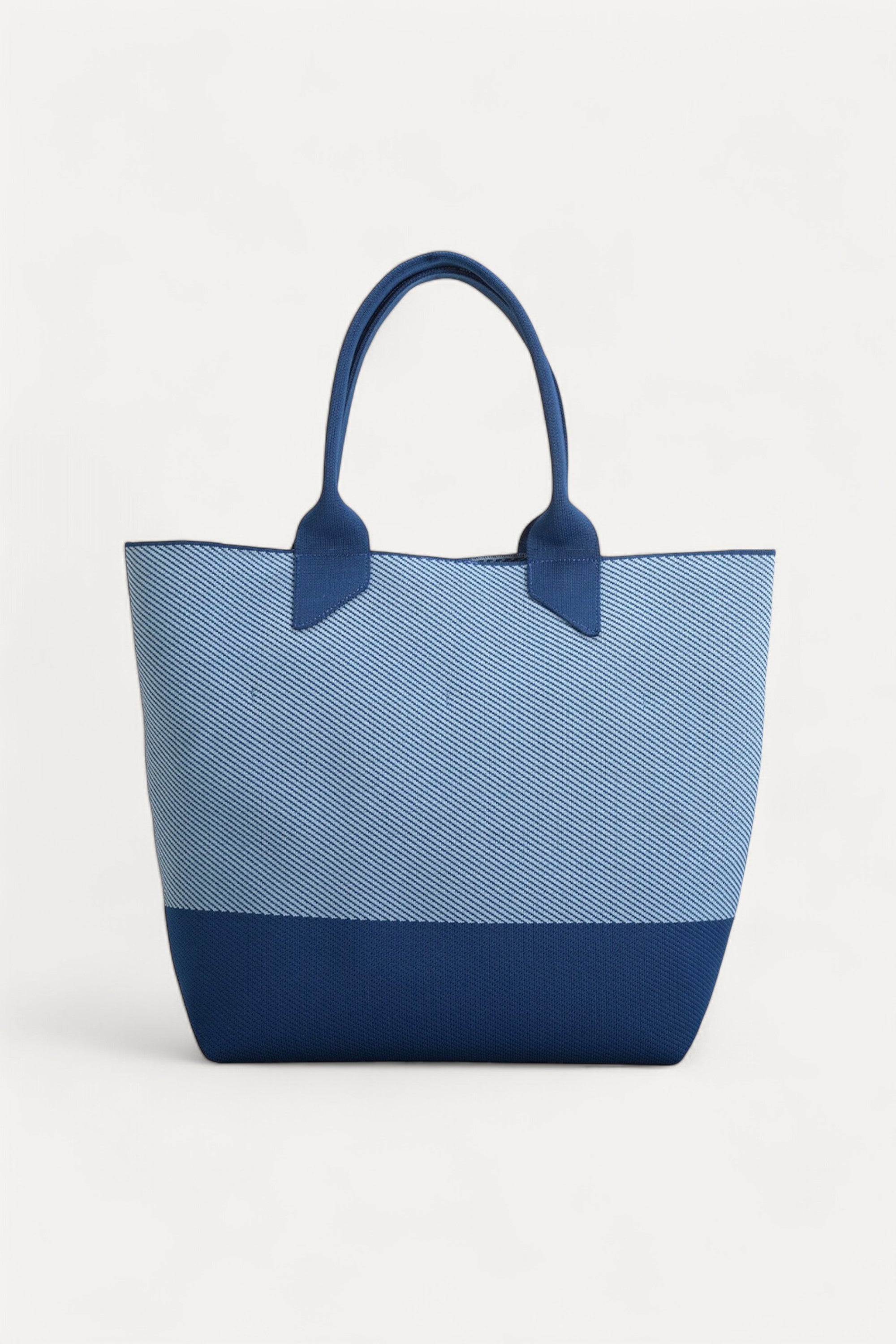 Rioz blue tote bag for women with dual handles, spacious design, and stylish fabric finish  made from recycled PET bottles for sustainable everyday use.