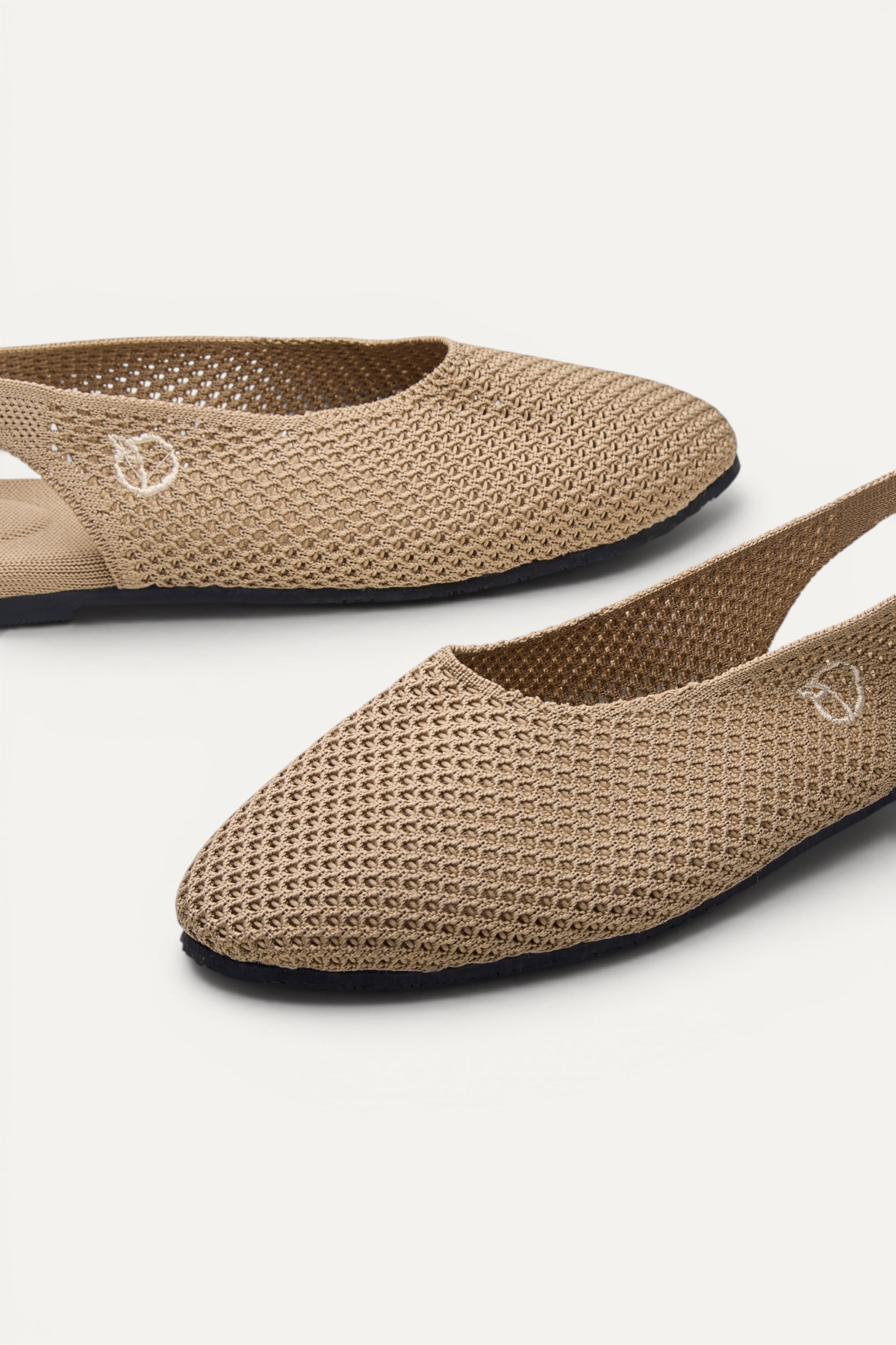 Side view of Rioz Sand Airknit Slingbacks, breathable open-mesh almond-toe knit flats for women.