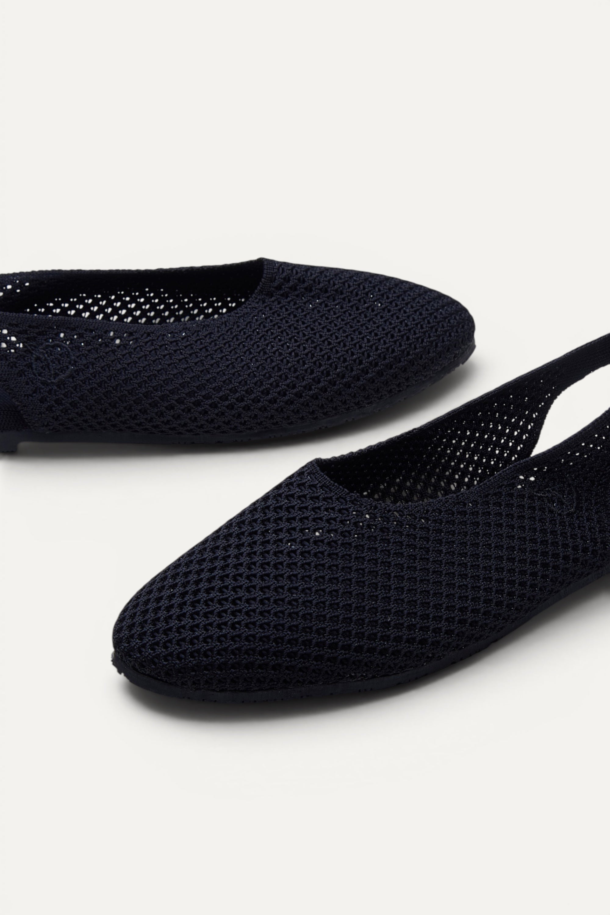 Top view of Rioz Airknit Slingbacks (black, almond-toe), lightweight knit flats made in India from rPET.