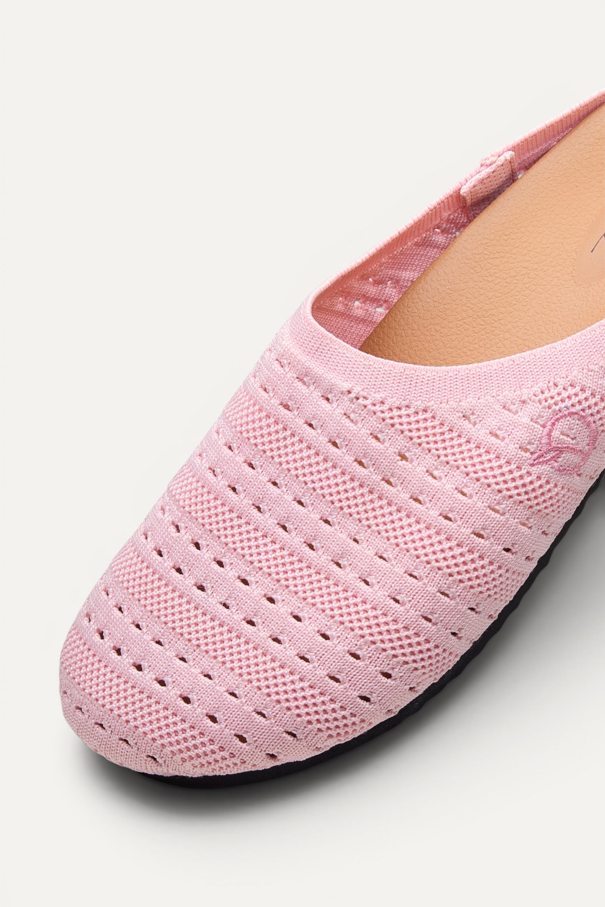 Side view of Rioz Pink Lumi Mules, breathable pointelle knit closed-toe slip-on clogs.