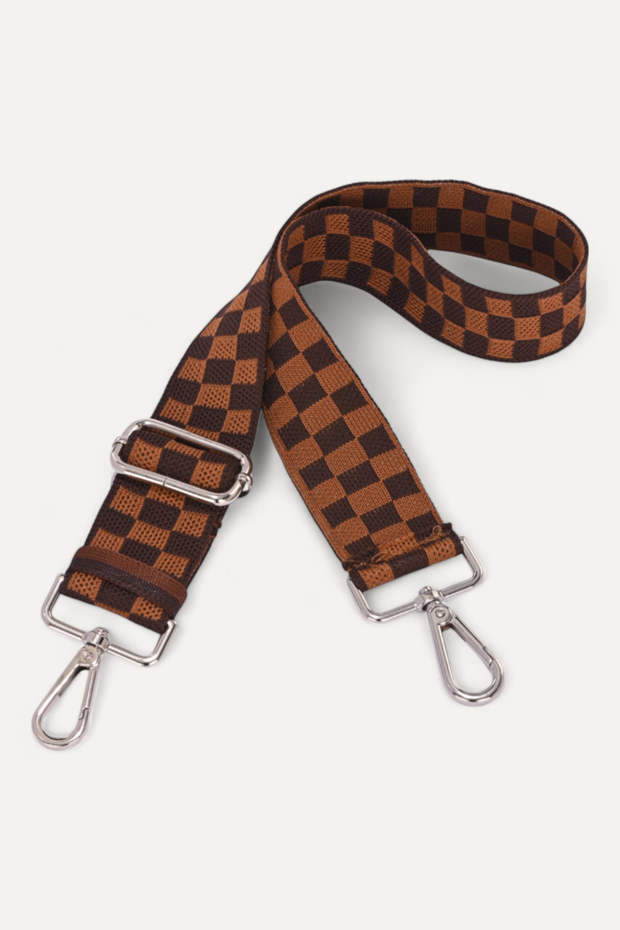 Brown and black checkered strap with metal buckles on a white background