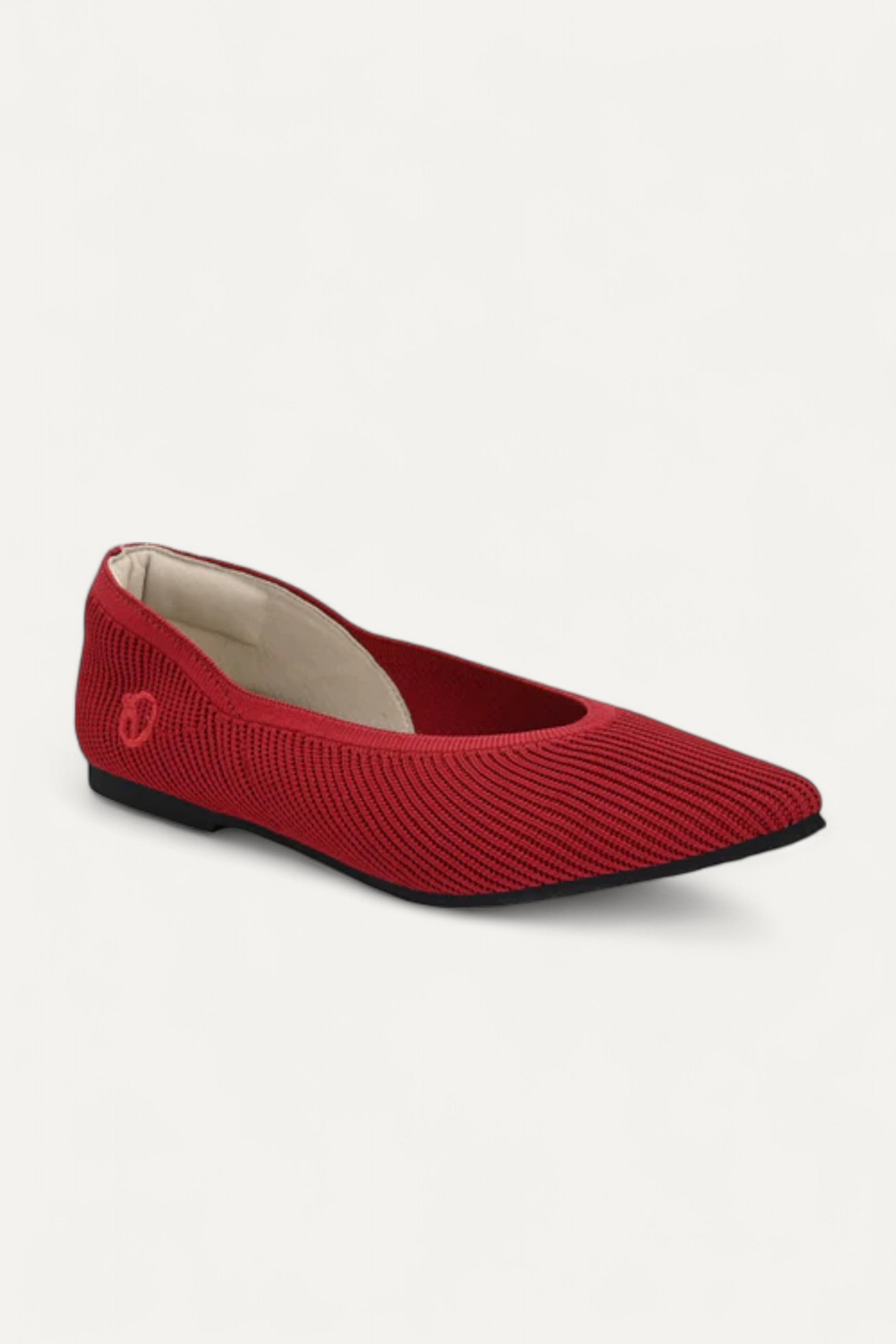 Side view of red pointed-toe ballet flat made from recycled plastic bottles
