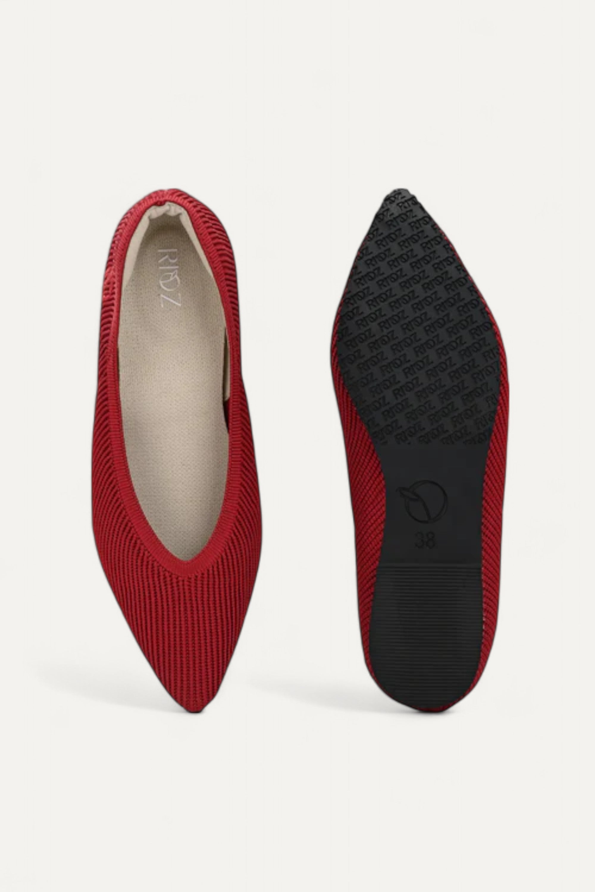 Top and bottom view of red pointed-toe flats showing black sole on white background
