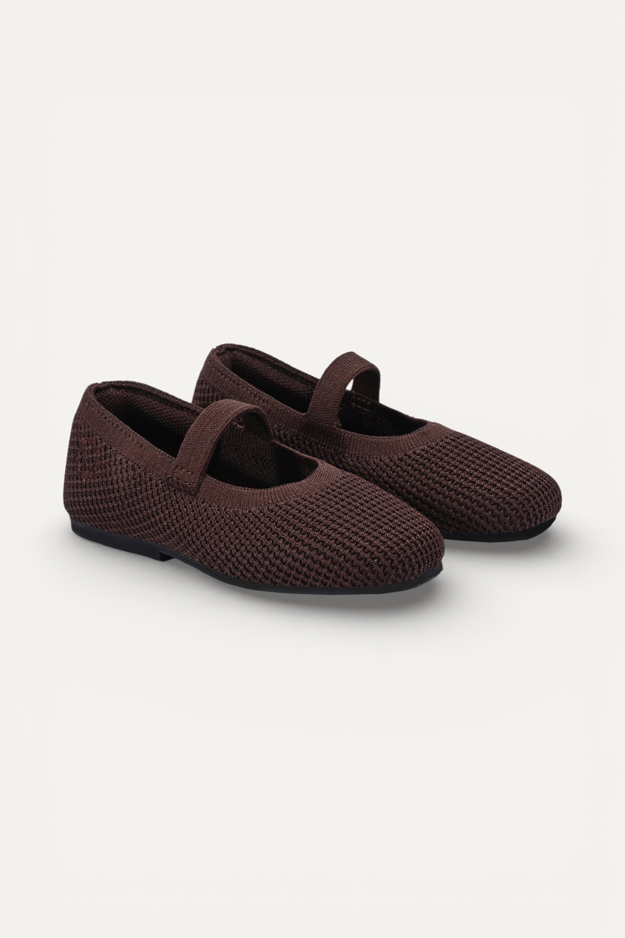 Kids Brown knit Mary Jane shoes with black strap, made using zero-waste 3D knitting from recycled PET (rPET) plastic bottles, lightweight breathable round-toe flats for everyday wear.