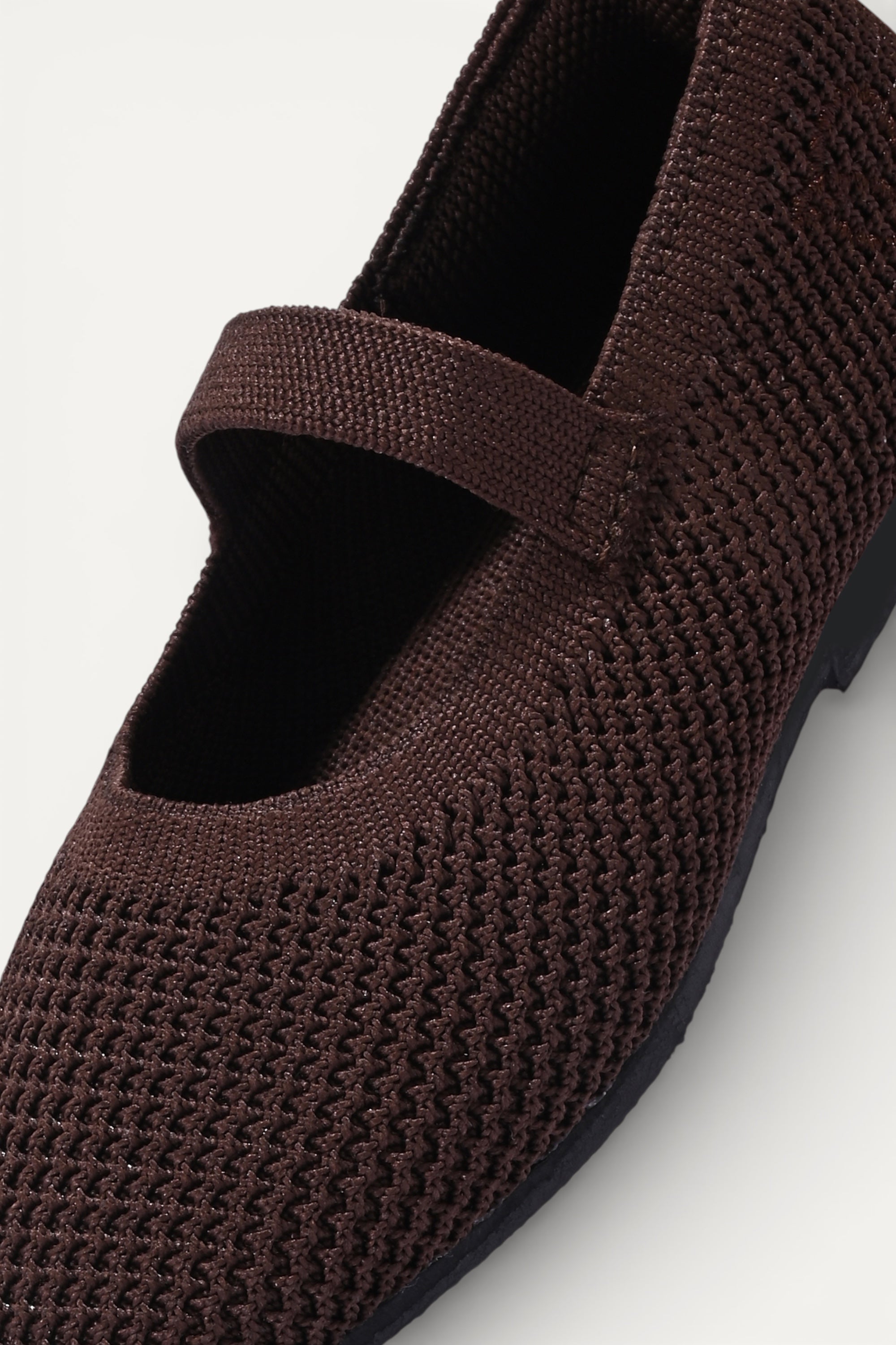 Kids Brown knit Mary Jane shoes with black strap, made using zero-waste 3D knitting from recycled PET (rPET) plastic bottles, lightweight breathable round-toe flats for everyday wear.