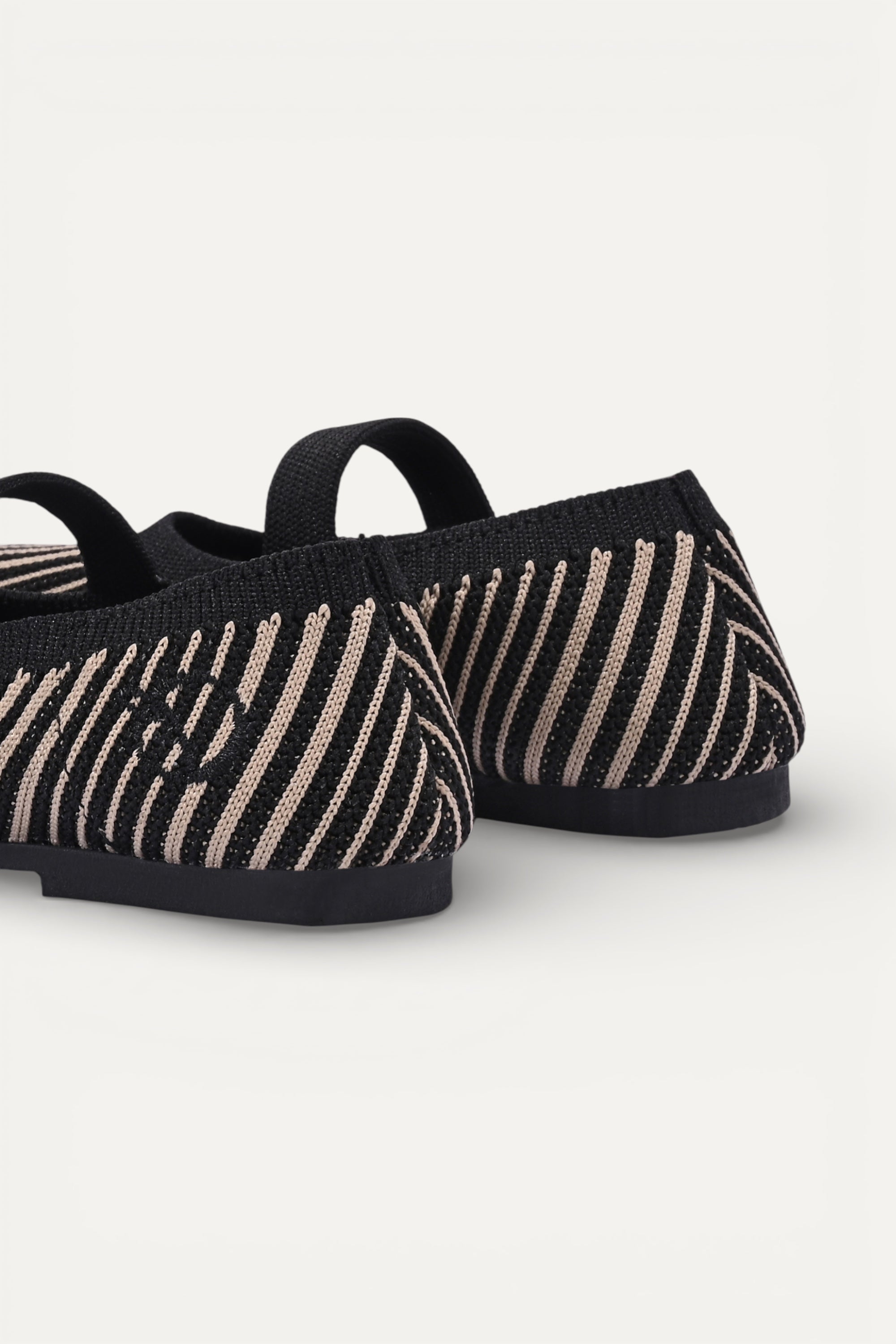 Kids cream knit Mary Jane shoes with black strap, made using zero-waste 3D knitting from recycled PET (rPET) plastic bottles, lightweight breathable round-toe flats for everyday wear.