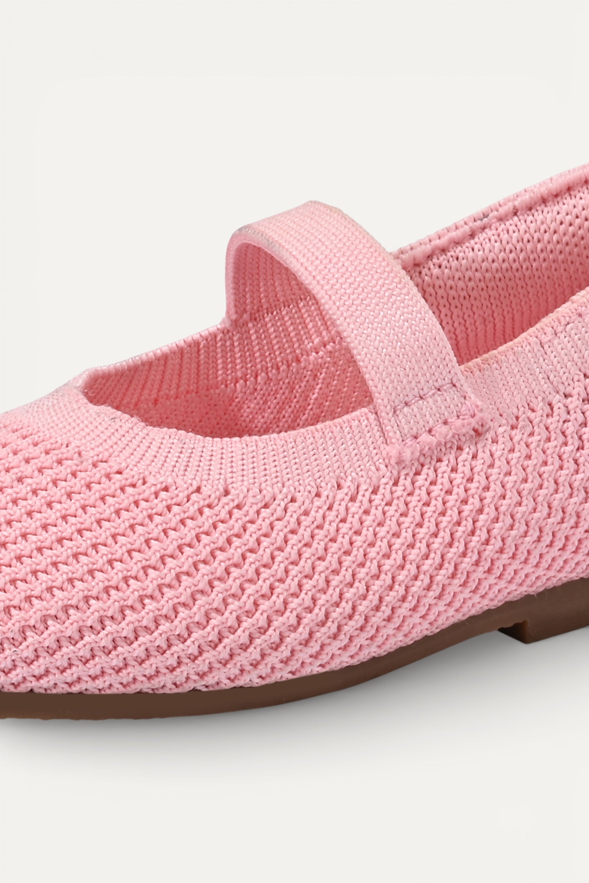 Kids Baby Pink knit Mary Jane shoes with black strap, made using zero-waste 3D knitting from recycled PET (rPET) plastic bottles, lightweight breathable round-toe flats for everyday wear.