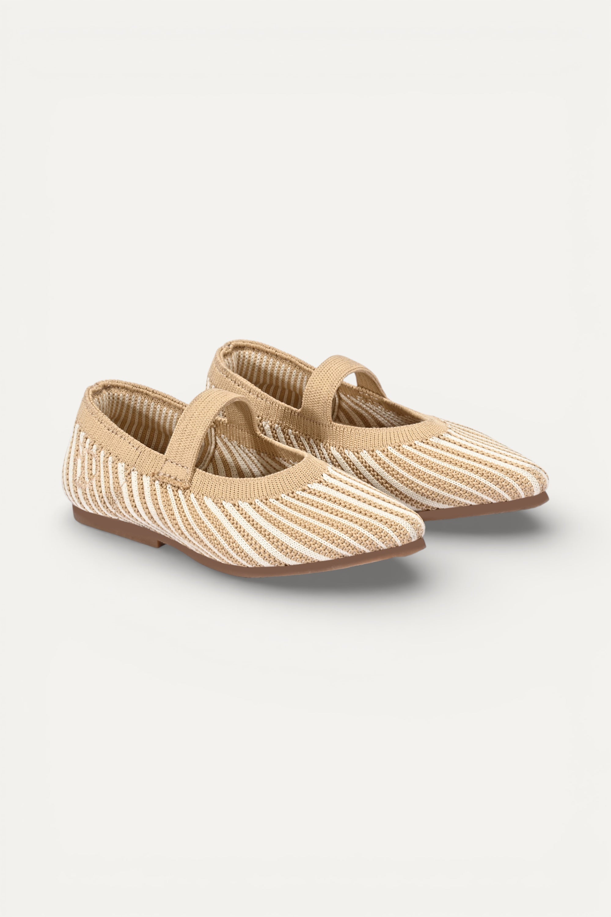 Beige and cream knit Mary Jane flats with strap, breathable striped pattern upper, lightweight flexible sole, comfortable everyday footwear for kids.