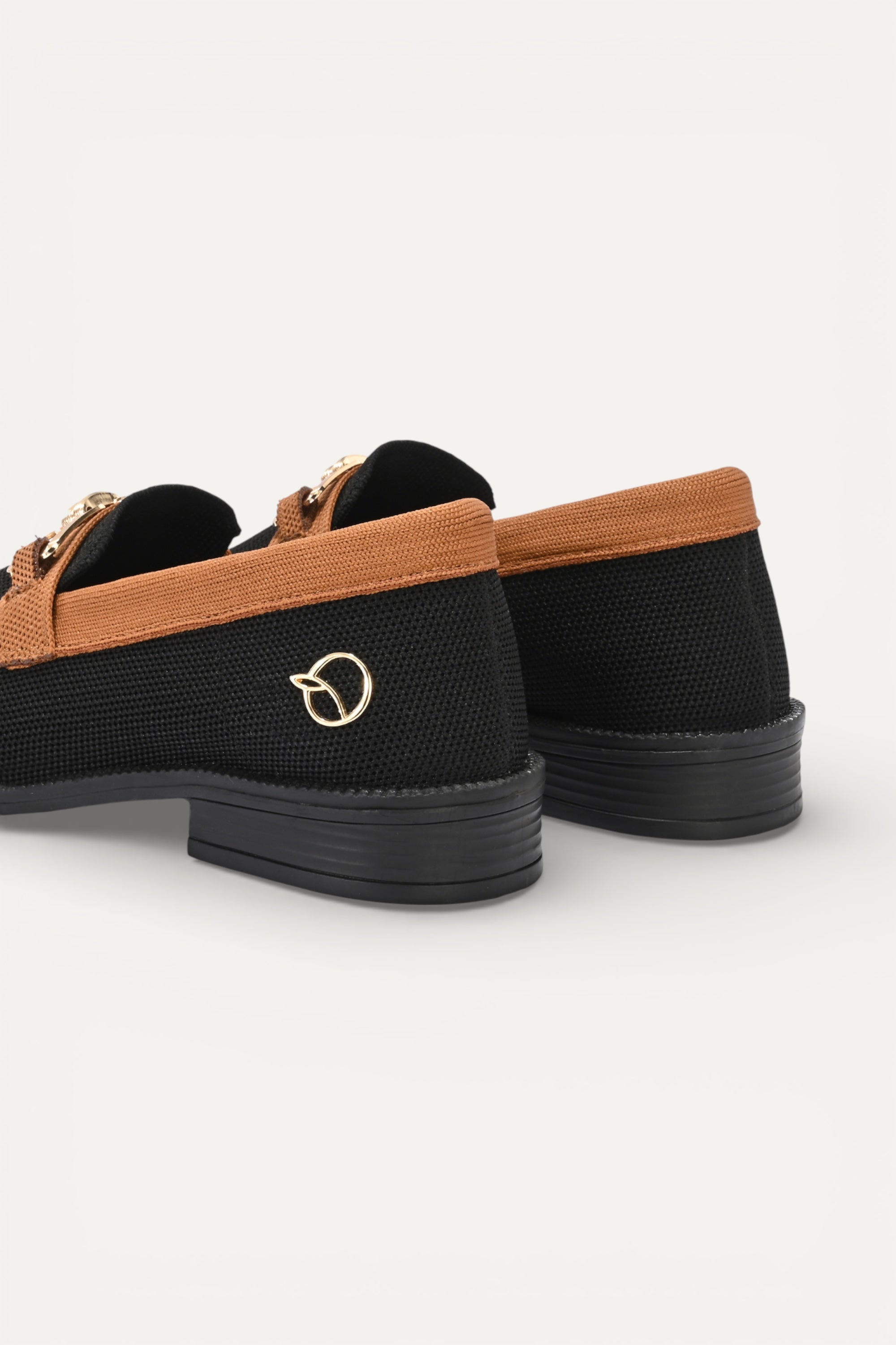 Rioz black knit slip-on loafers with brown trim and gold buckle detail,  eco-friendly fabric and cushioned sole casual shoes