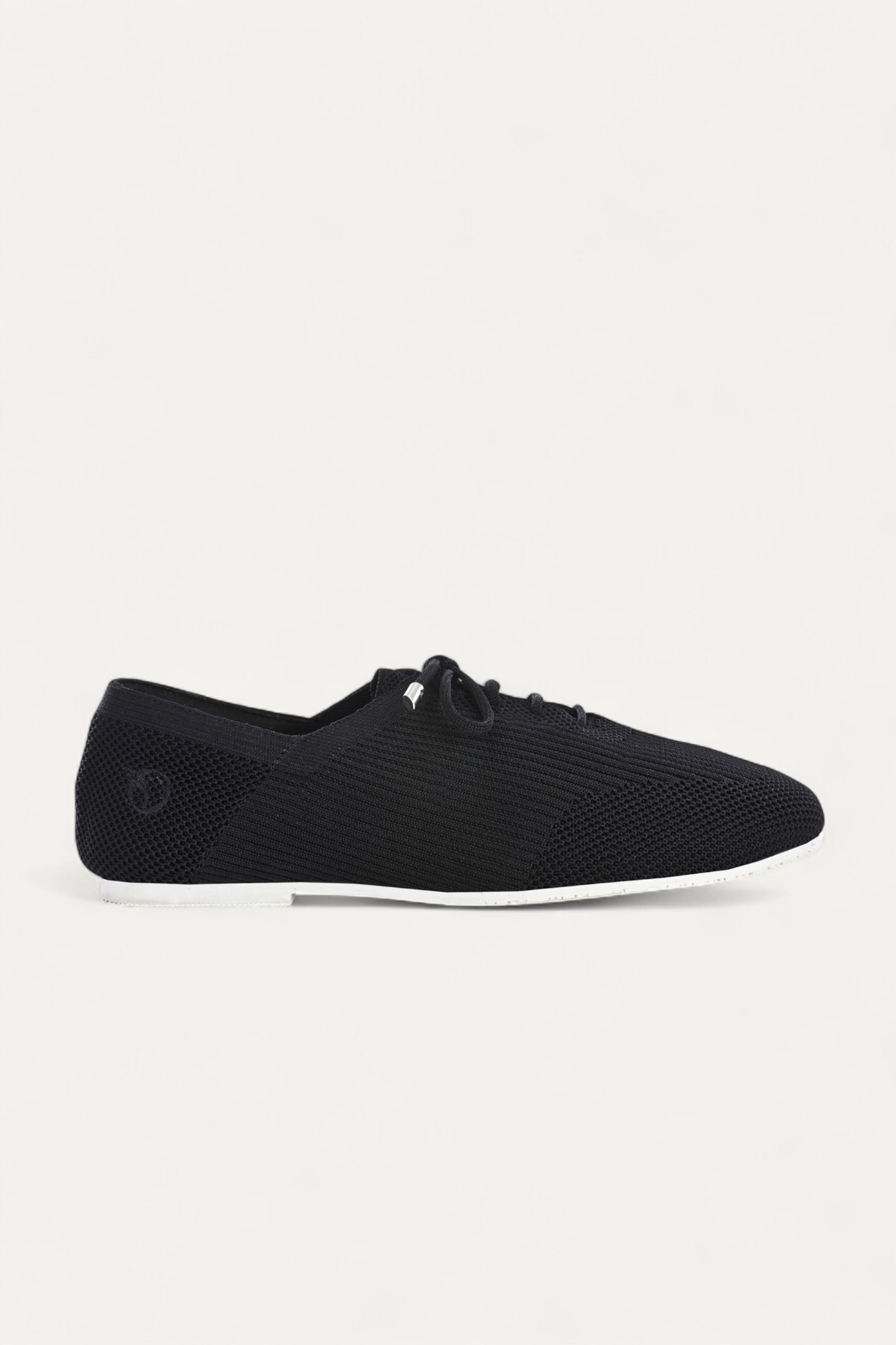 Rioz black knitted lace-up shoes with breathable mesh design, lightweight casual sneakers for women with flexible sole, angled view on neutral background.