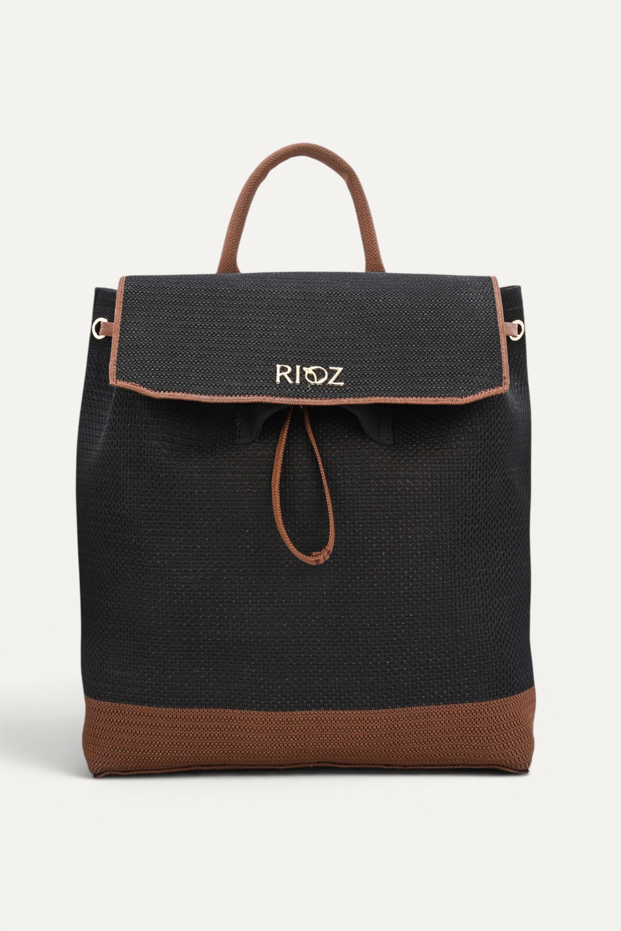 Eco-friendly black woven backpack with brown trim, flap closure and drawstring detail, top handle and shoulder straps, minimalist sustainable design and made from recycled PET bottles for  for everyday use.