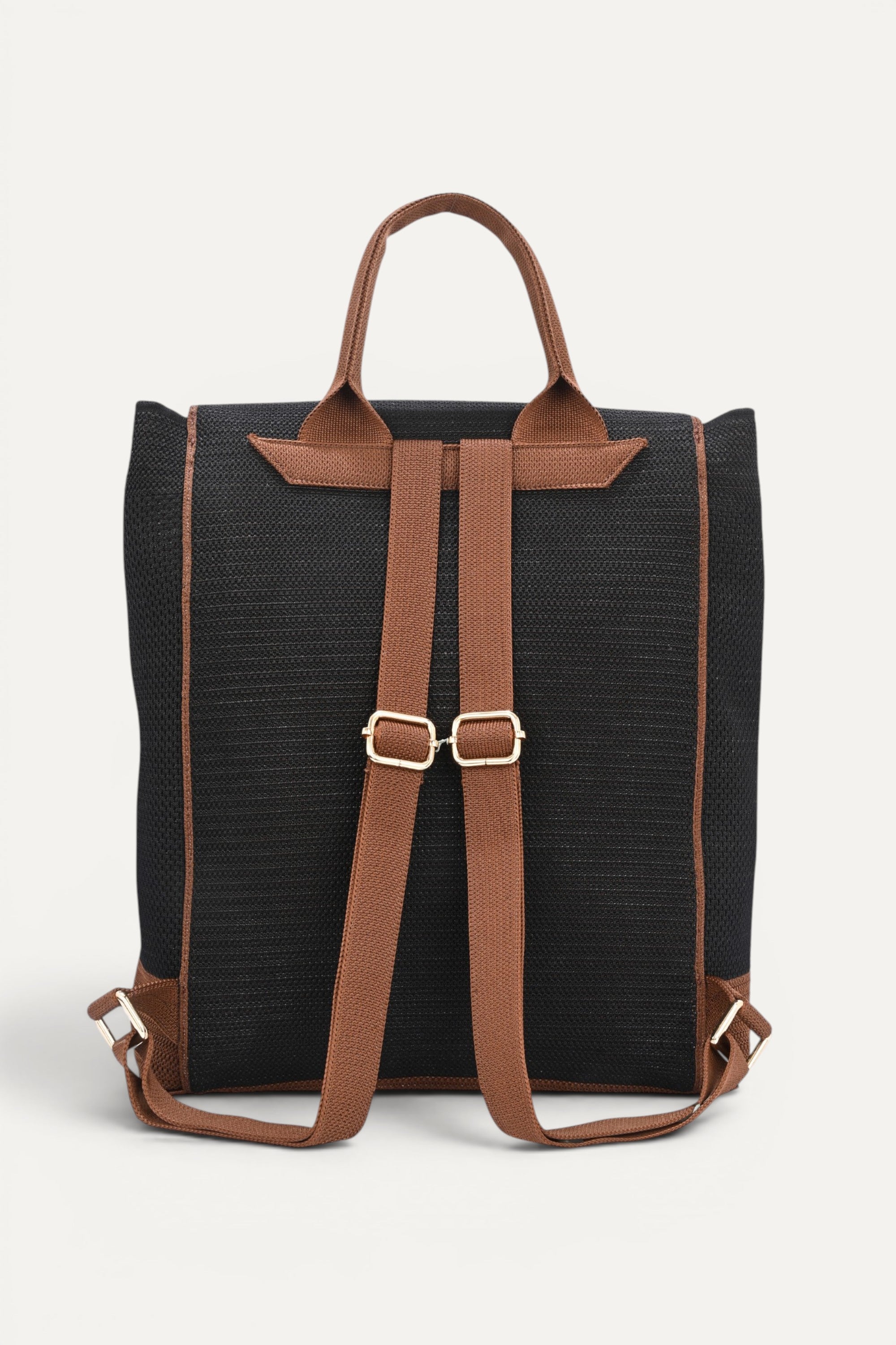 Eco-friendly black woven backpack with brown trim, flap closure and drawstring detail, top handle and shoulder straps, minimalist sustainable design and made from recycled PET bottles for  for everyday use.