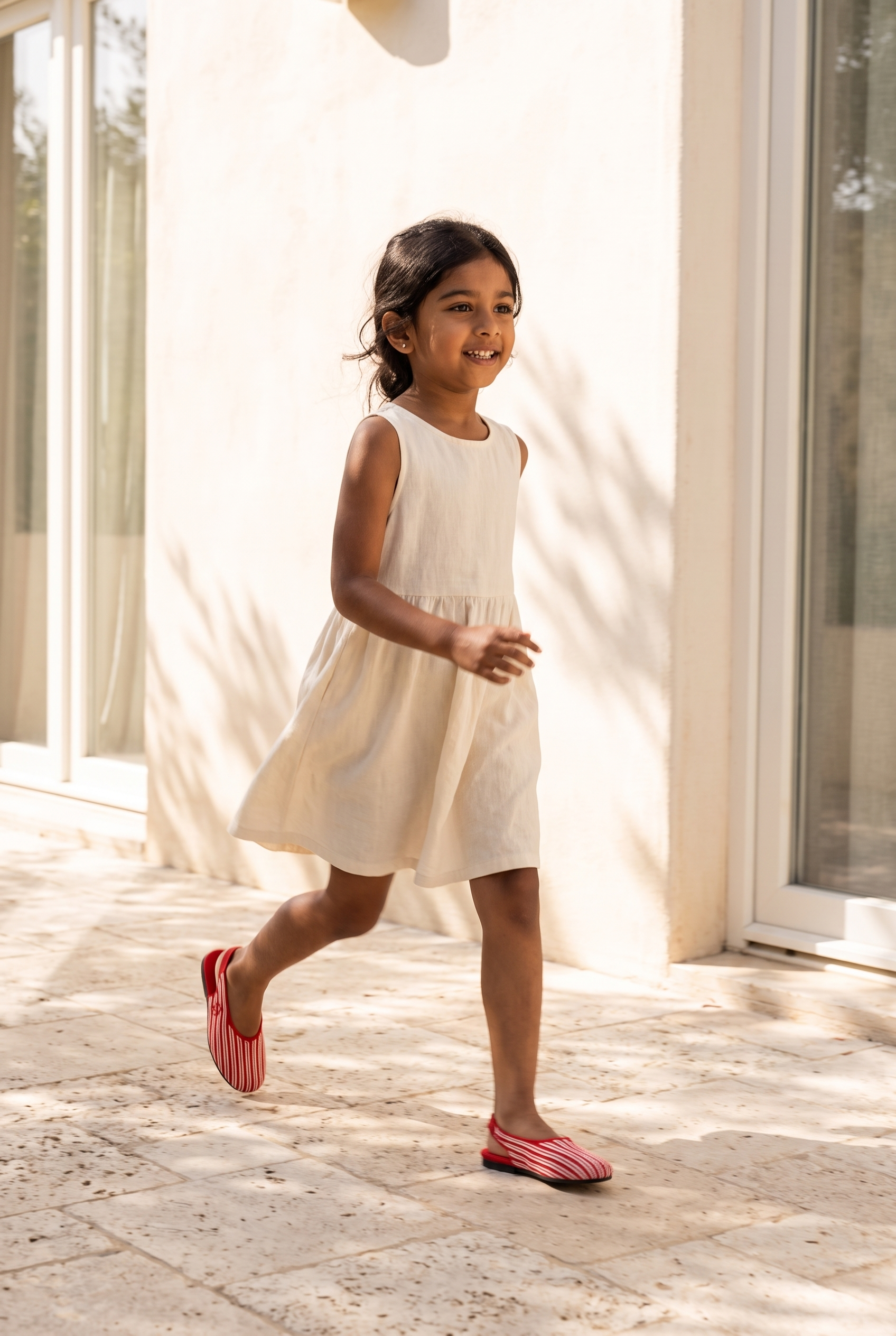 Kids Almond Slingback Red full model shot on girl, mid-walk stride